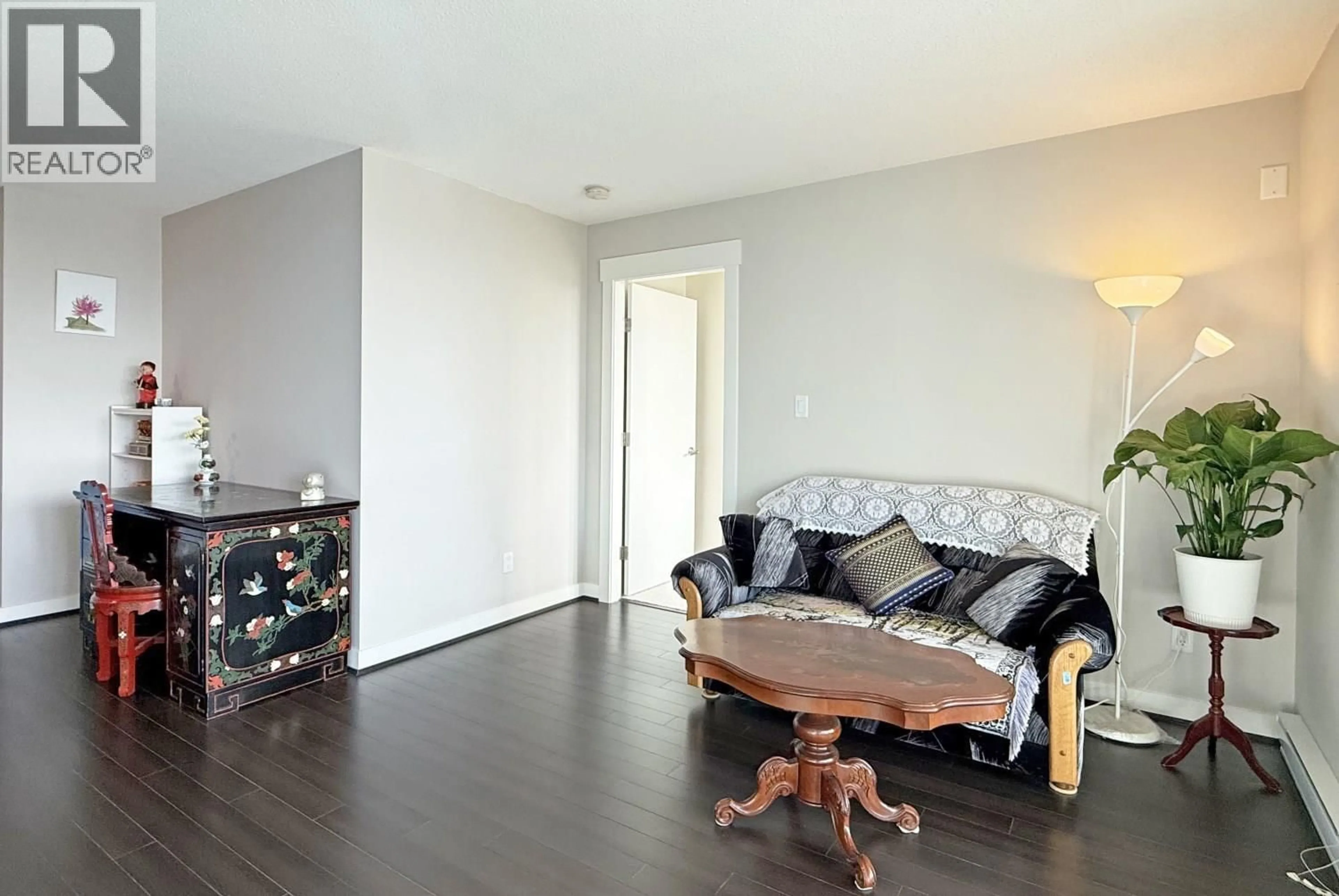 Living room with furniture, wood/laminate floor for 1002 - 6733 BUSWELL STREET, Richmond British Columbia V6Y0E3