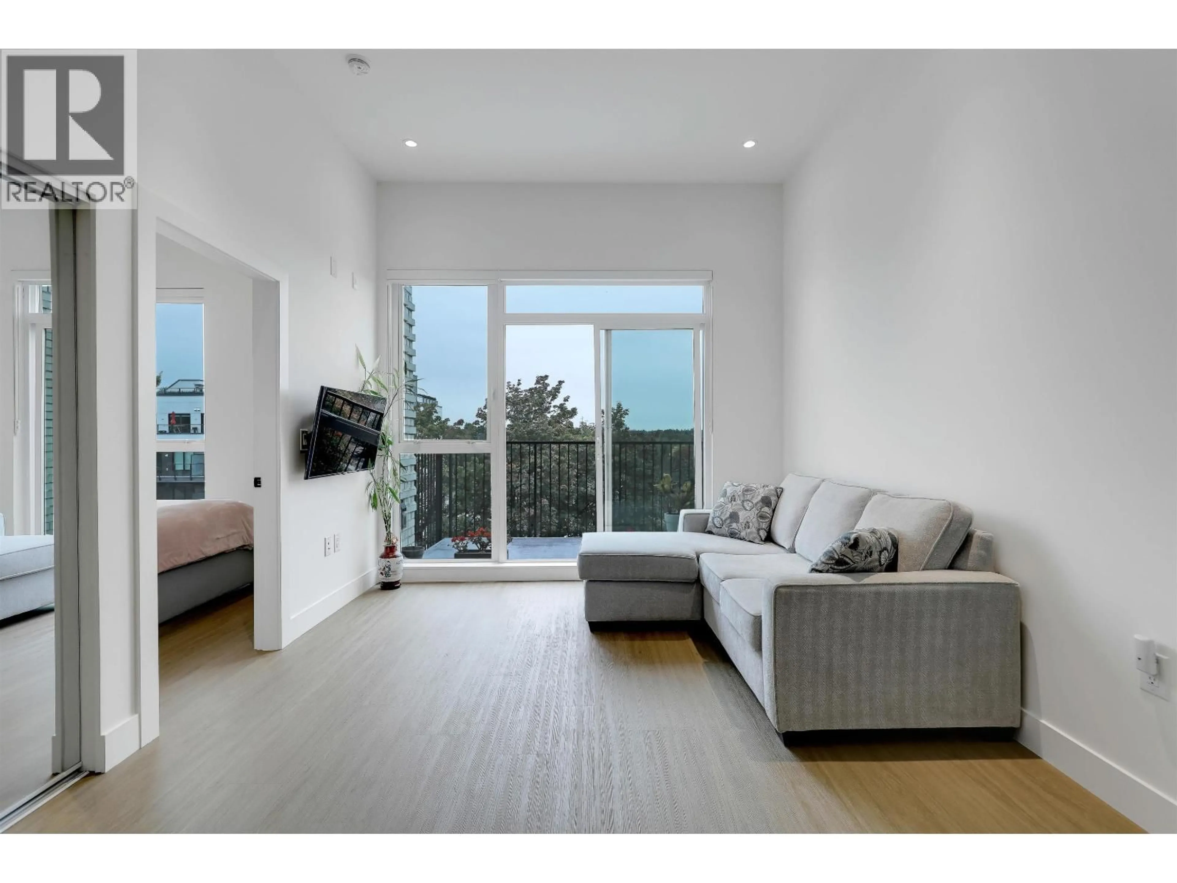 Living room with furniture, wood/laminate floor for 604 - 2235 BROADWAY, Vancouver British Columbia V5N0J5