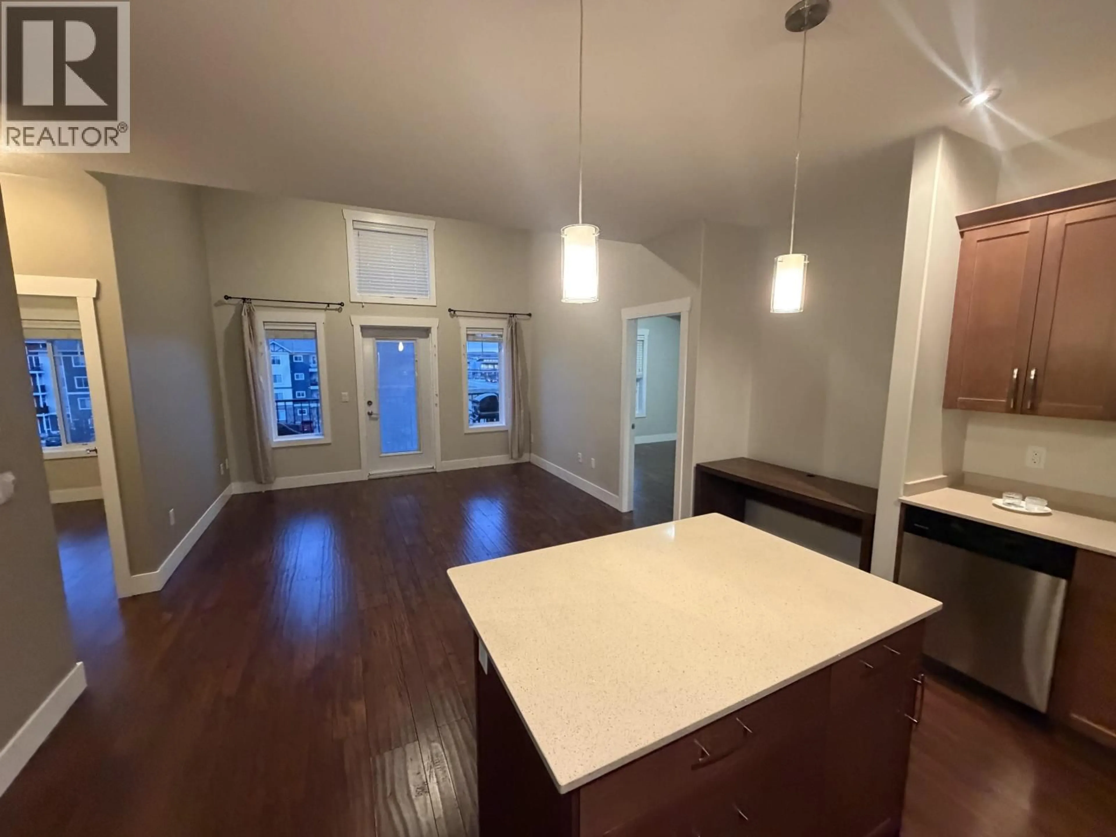 Open concept kitchen, wood/laminate floor for 401 - 11203 105 AVENUE, Fort St. John British Columbia V1J0L3