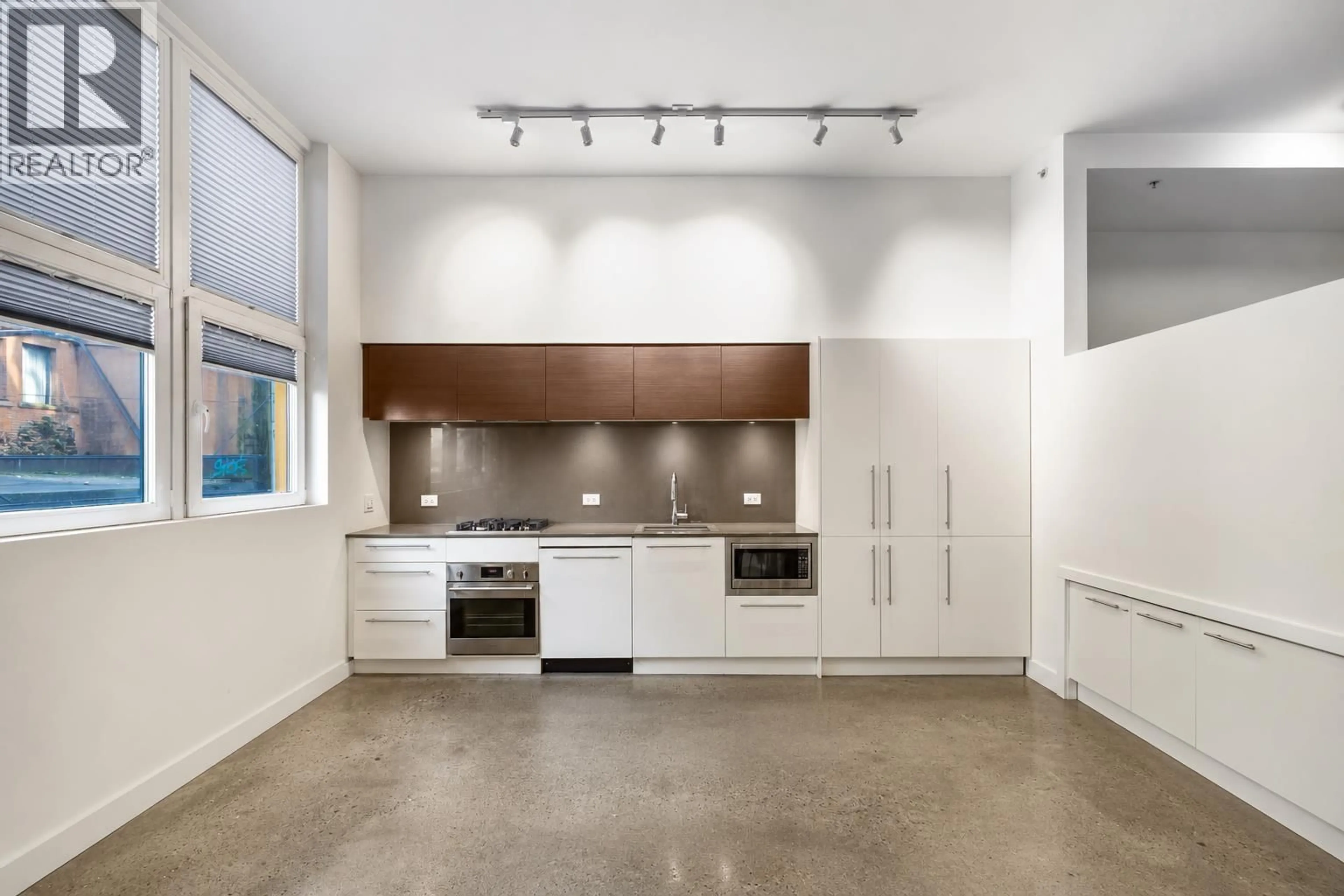 Contemporary kitchen, cement floor for 208 - 150 CORDOVA STREET, Vancouver British Columbia V6A0E7