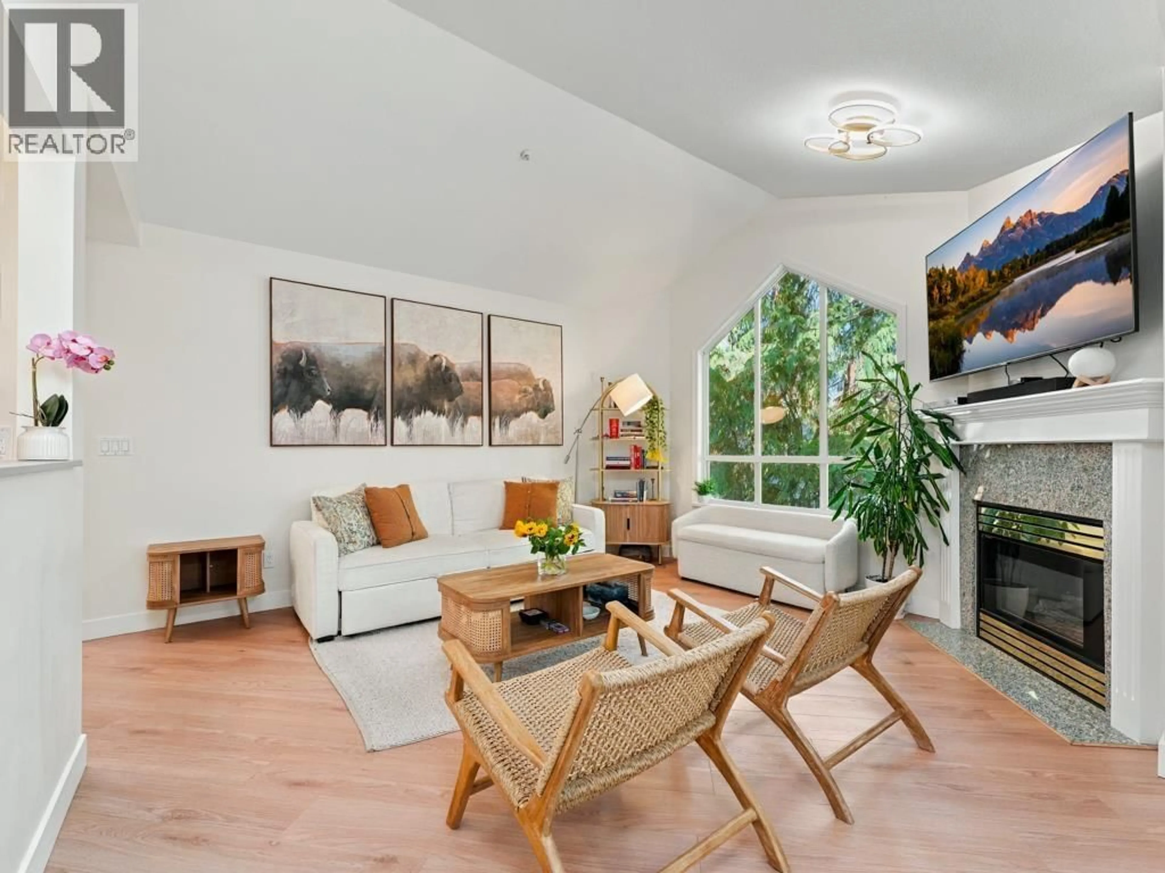 Living room with furniture, wood/laminate floor for 308 - 1150 LYNN VALLEY ROAD, North Vancouver British Columbia V7J1Z9