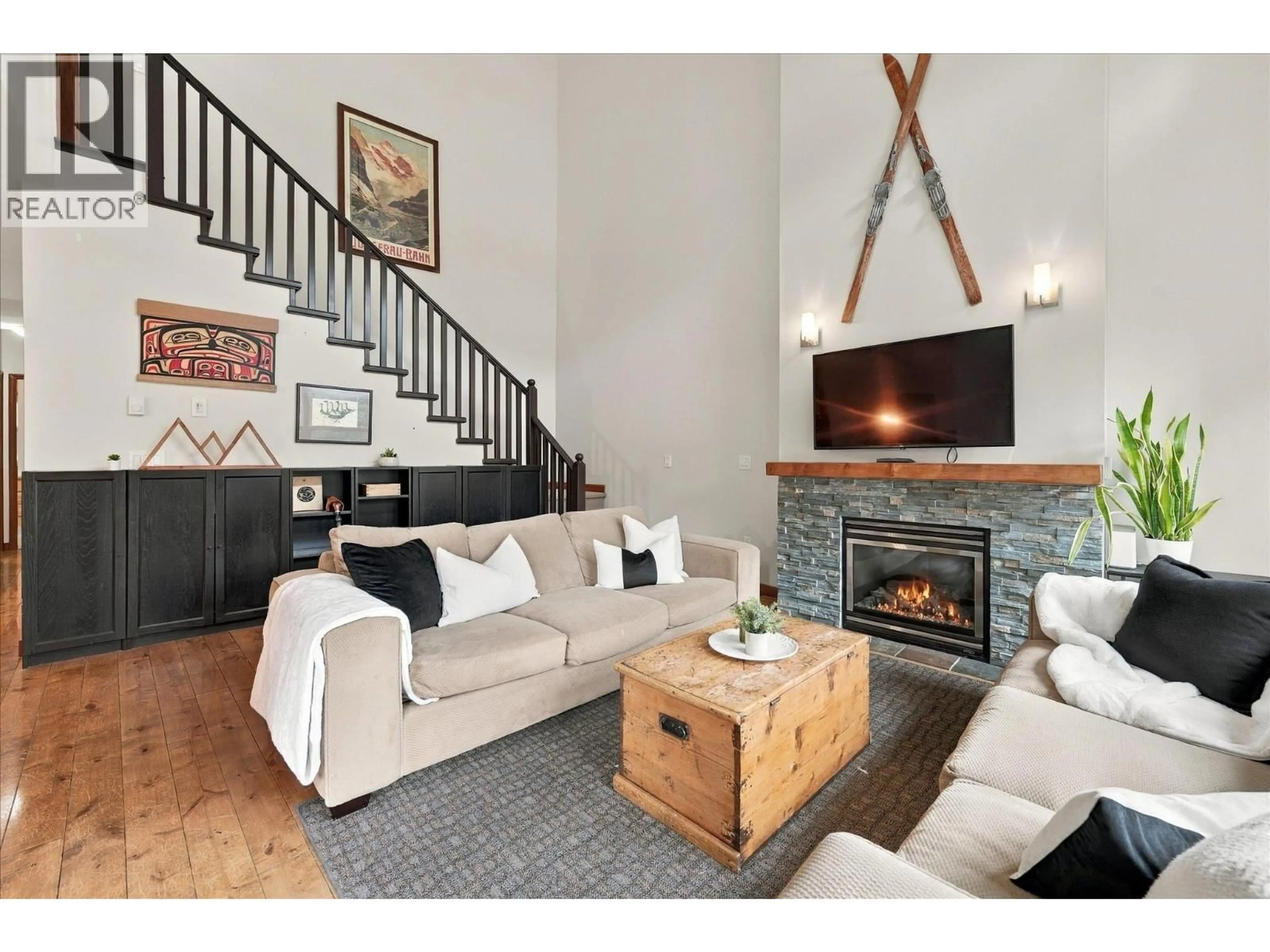 Living room with furniture, wood/laminate floor for 309 - 3300 PTARMIGAN PLACE, Whistler British Columbia V8E0V5