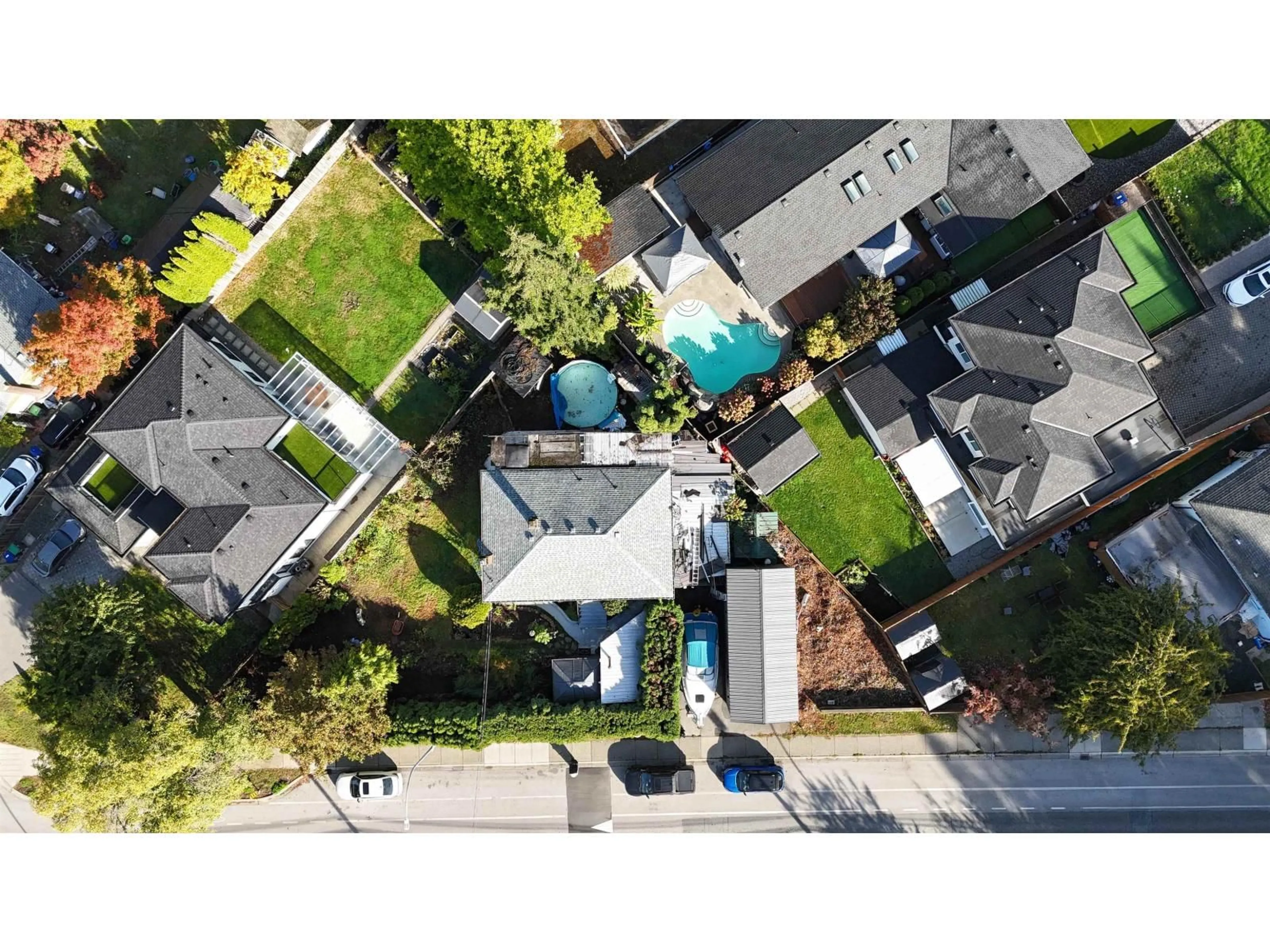 A pic from outside/outdoor area/front of a property/back of a property/a pic from drone, street for 12585 100 AVENUE, Surrey British Columbia V3V2X6
