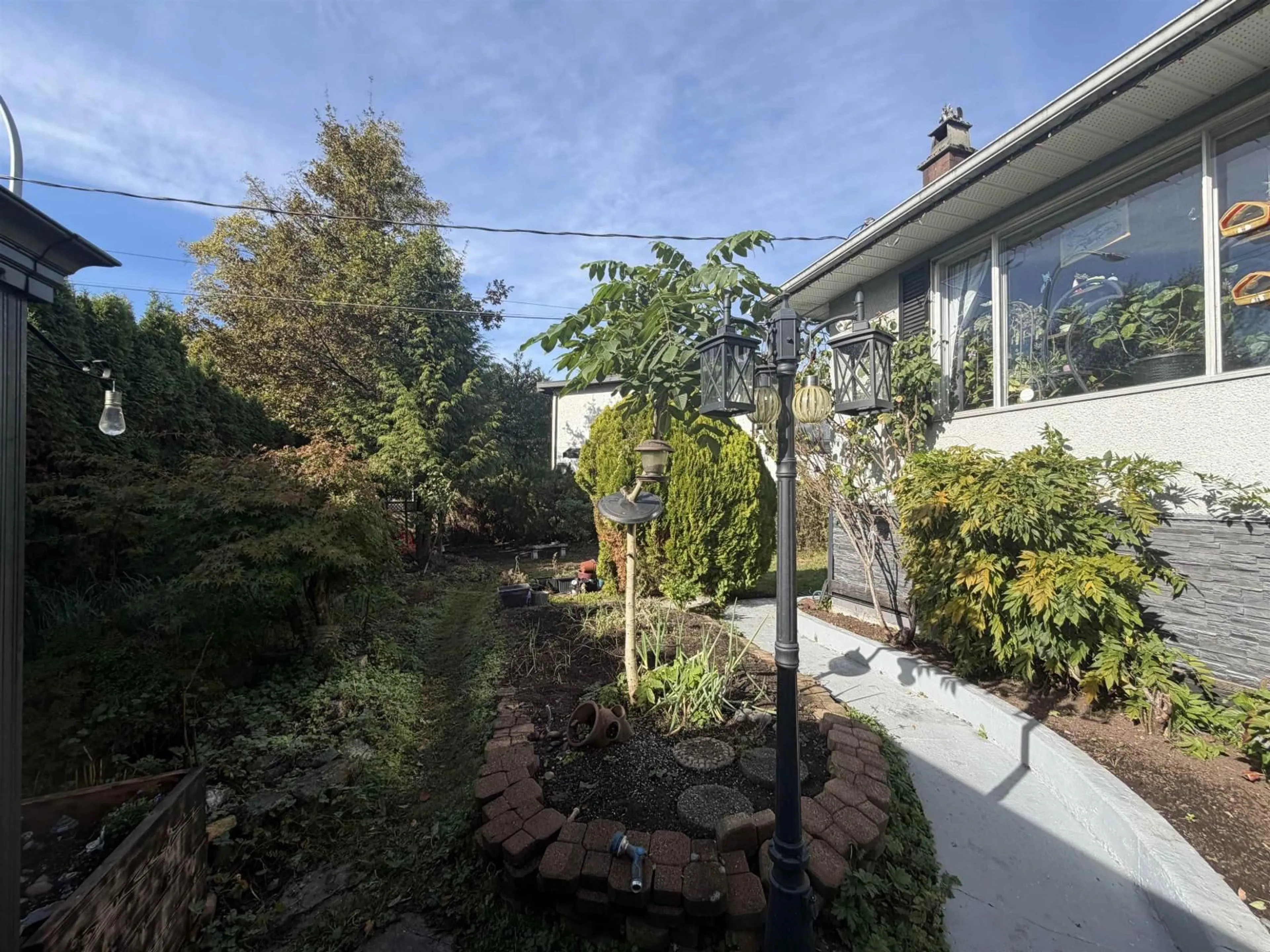 A pic from outside/outdoor area/front of a property/back of a property/a pic from drone, street for 12585 100 AVENUE, Surrey British Columbia V3V2X6