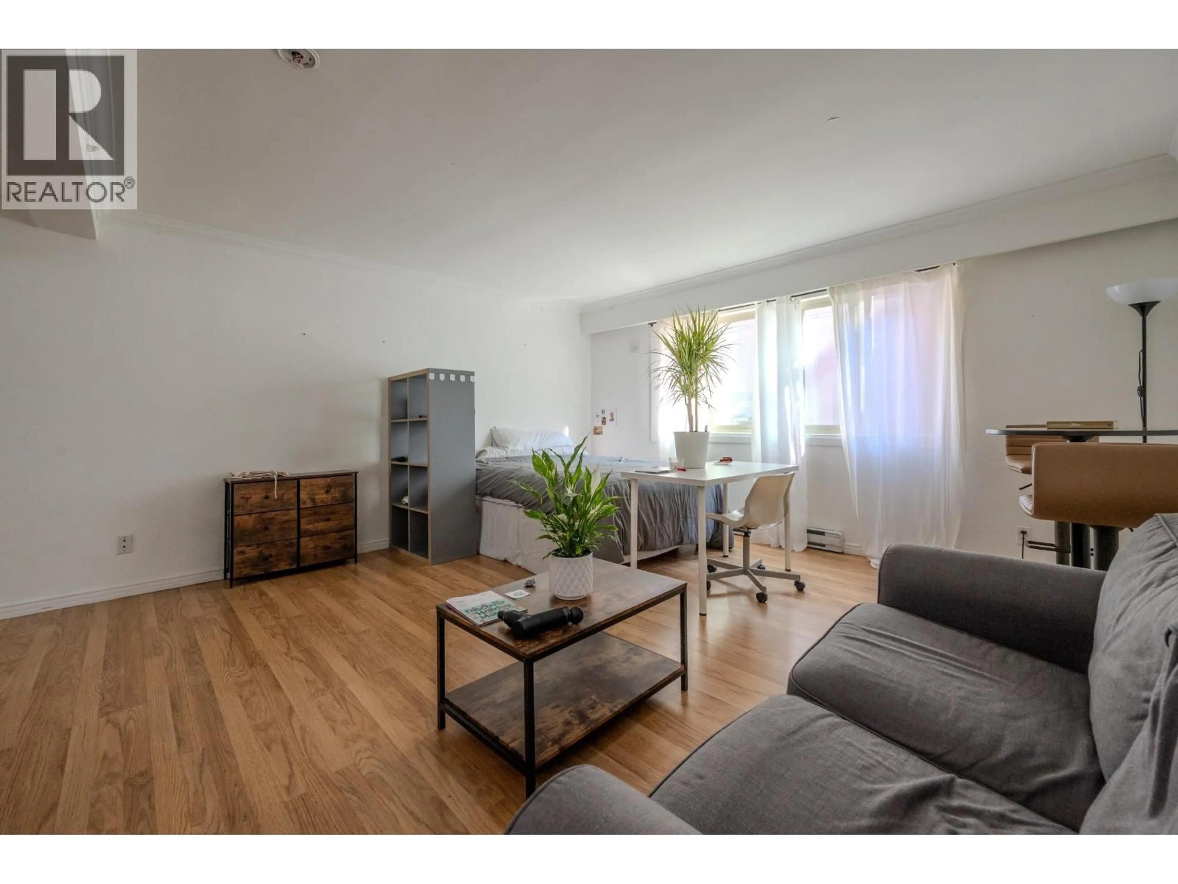 Living room with furniture, wood/laminate floor for 104 - 1940 BARCLAY STREET, Vancouver British Columbia V6G1L3