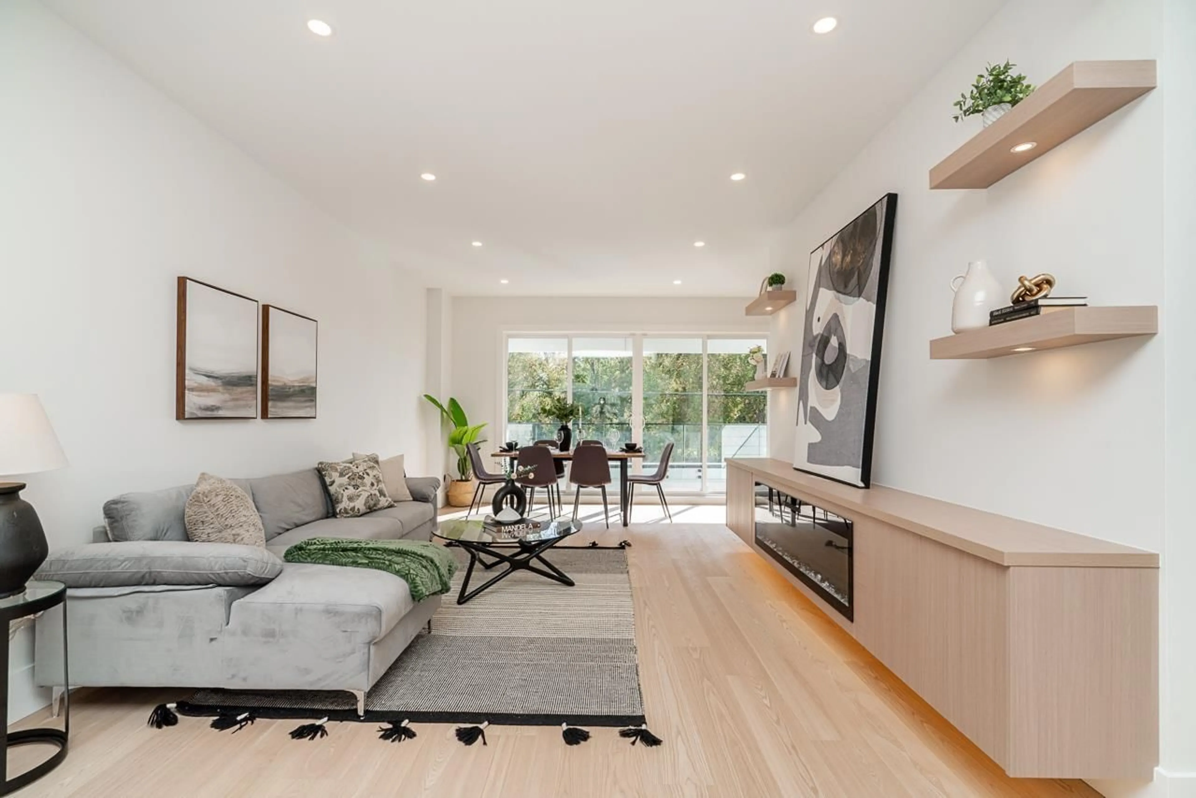 Living room with furniture, wood/laminate floor for 101 - 17059 0 AVENUE, Surrey British Columbia V3Z9N9
