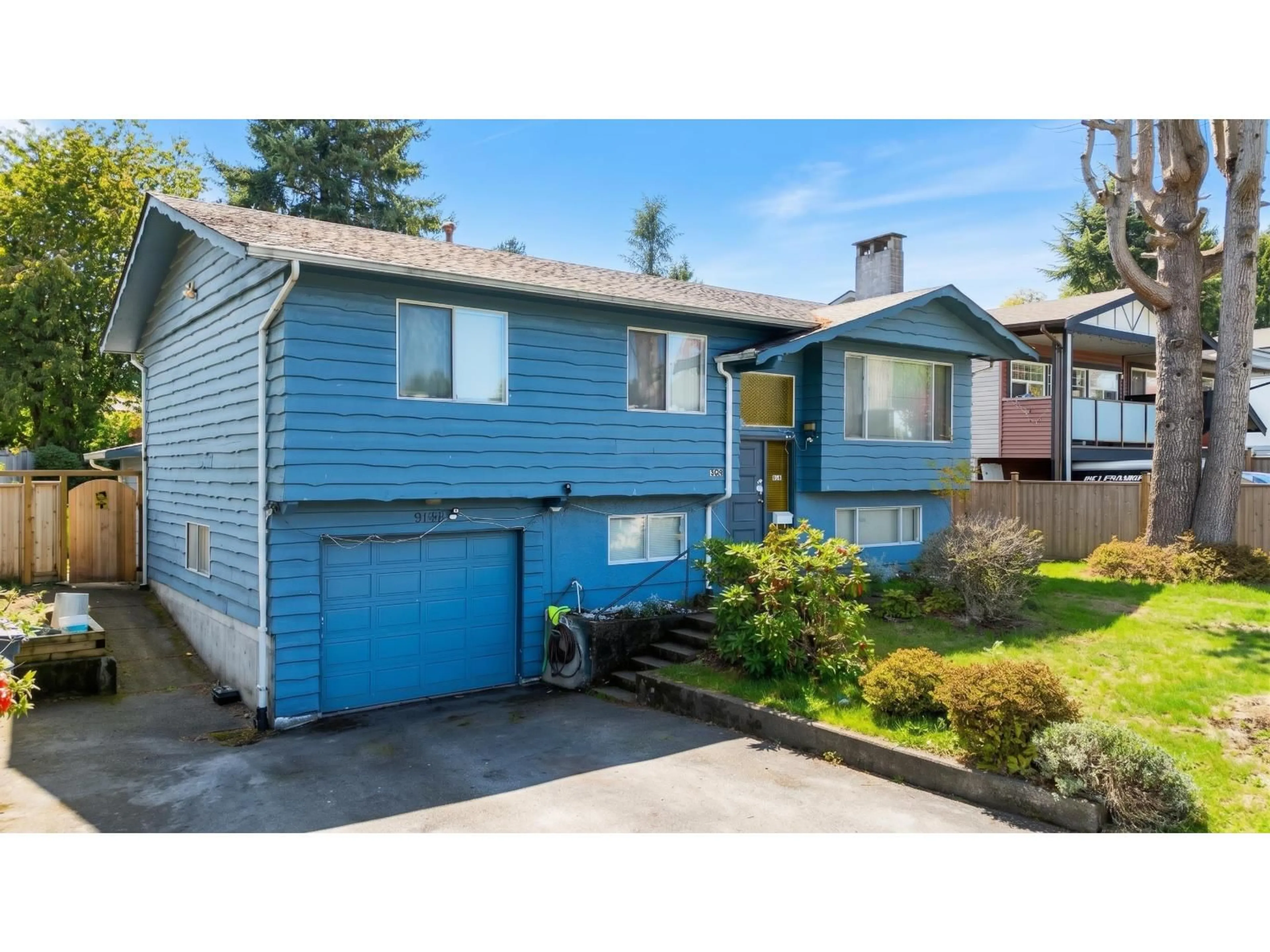 Home with vinyl exterior material, street for 9141 PRINCE CHARLES BOULEVARD, Surrey British Columbia V3V1S1