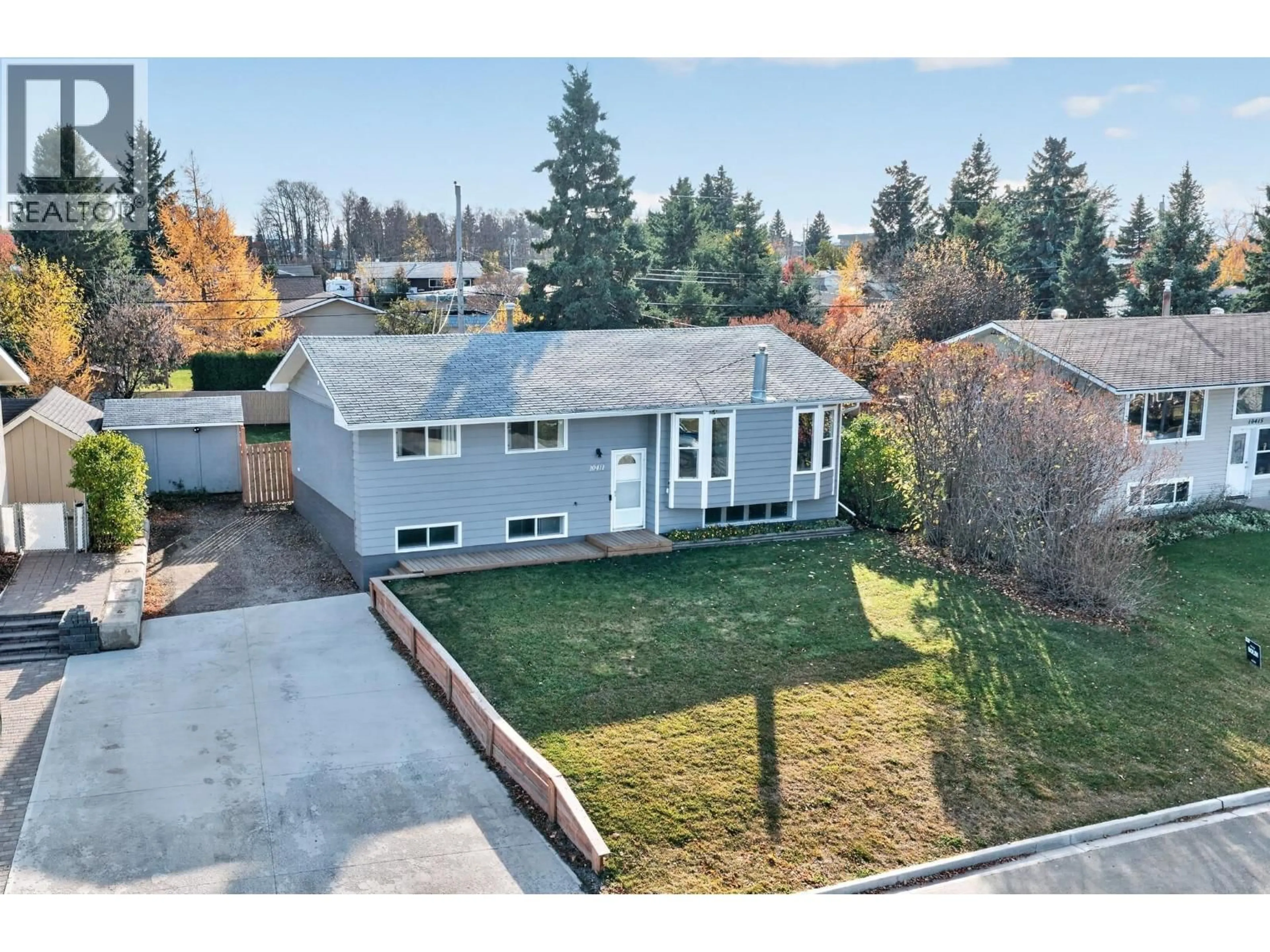 A pic from outside/outdoor area/front of a property/back of a property/a pic from drone, street for 10411 112 AVENUE, Fort St. John British Columbia V1J2W6