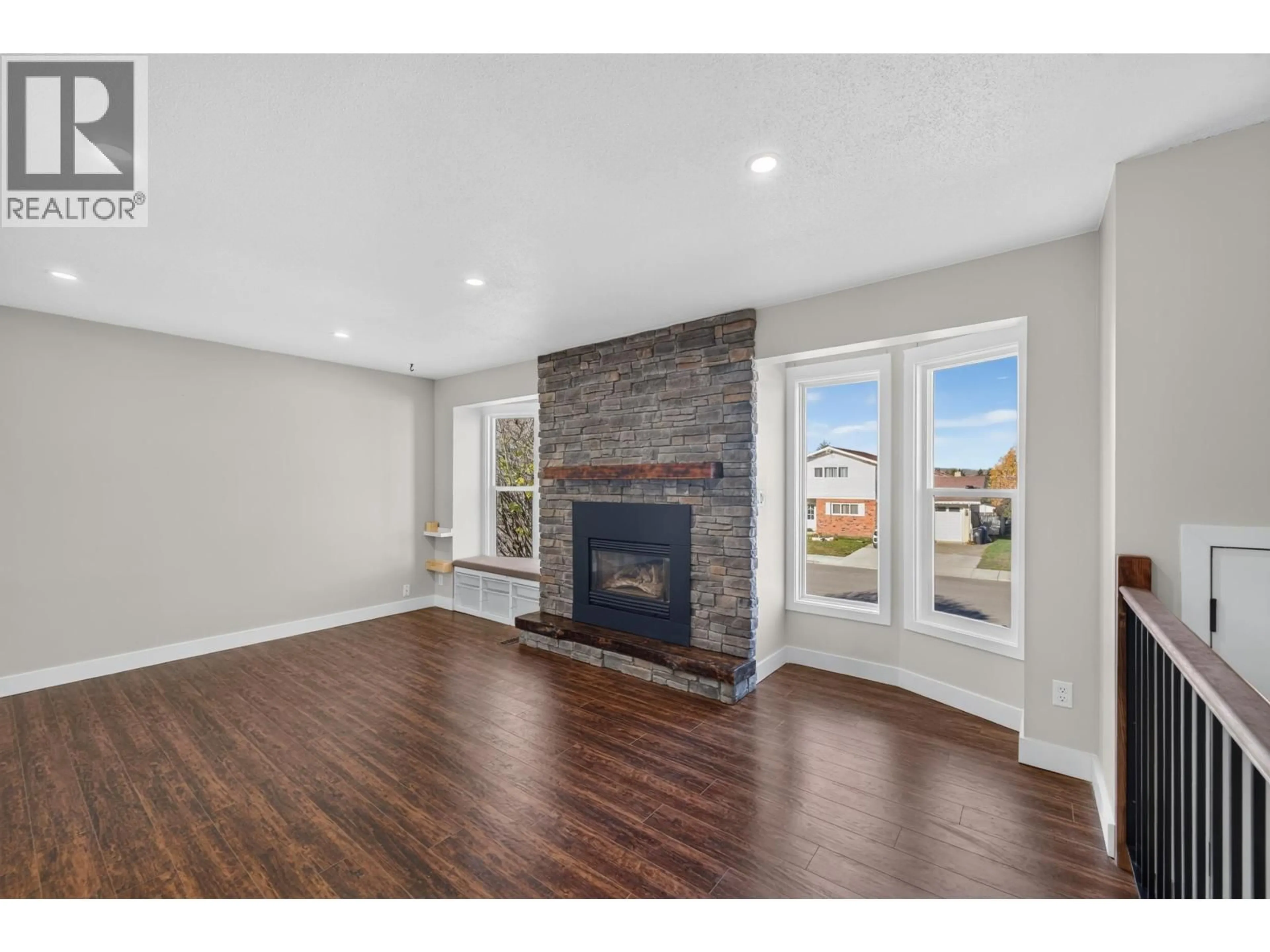 Living room with furniture, wood/laminate floor for 10411 112 AVENUE, Fort St. John British Columbia V1J2W6