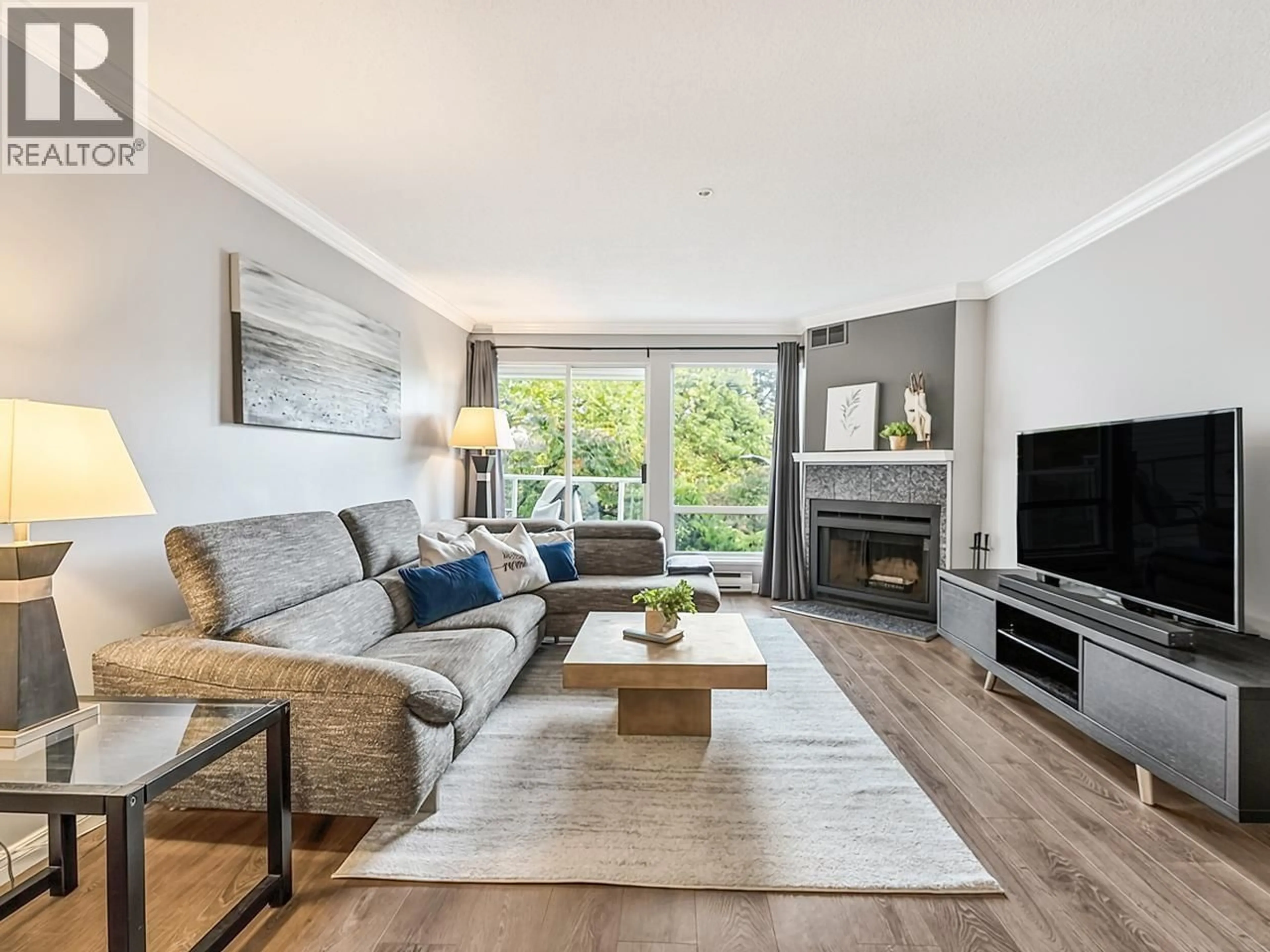 Living room with furniture, wood/laminate floor for 210 - 889 7TH AVENUE, Vancouver British Columbia V5Z1C2