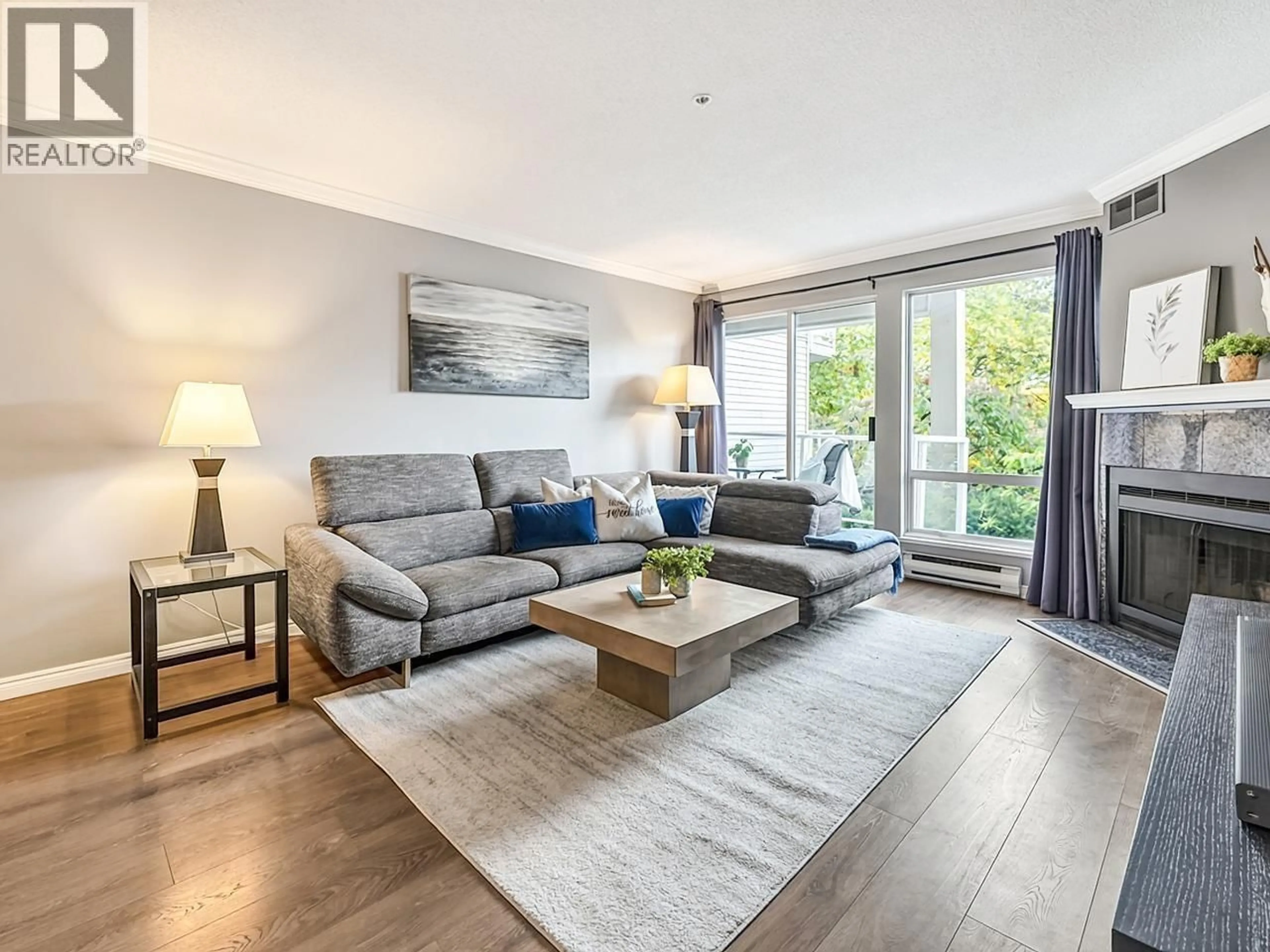 Living room with furniture, wood/laminate floor for 210 - 889 7TH AVENUE, Vancouver British Columbia V5Z1C2