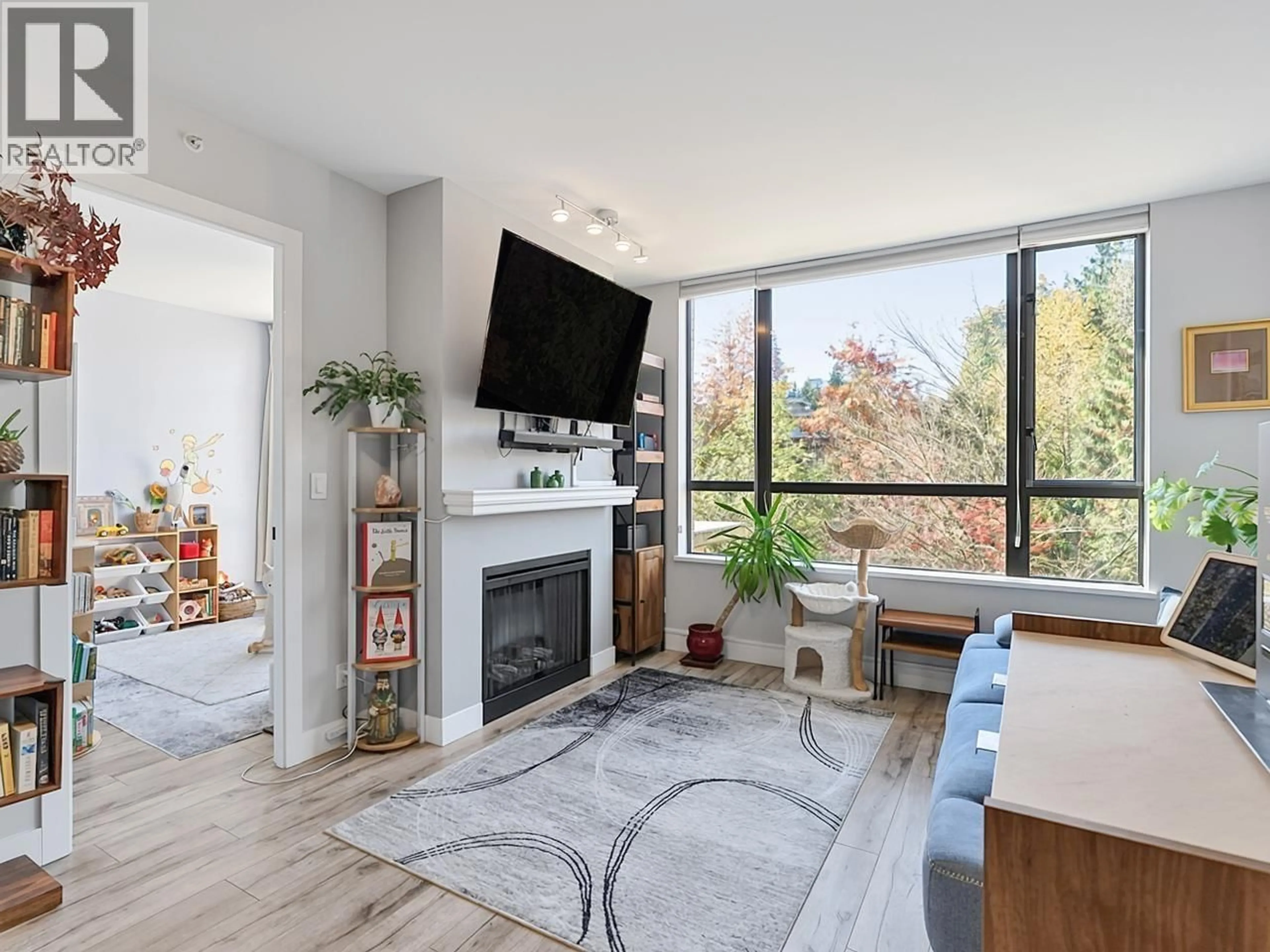 Living room with furniture, unknown for 401 - 9300 UNIVERSITY CRESCENT, Burnaby British Columbia V5A4X9