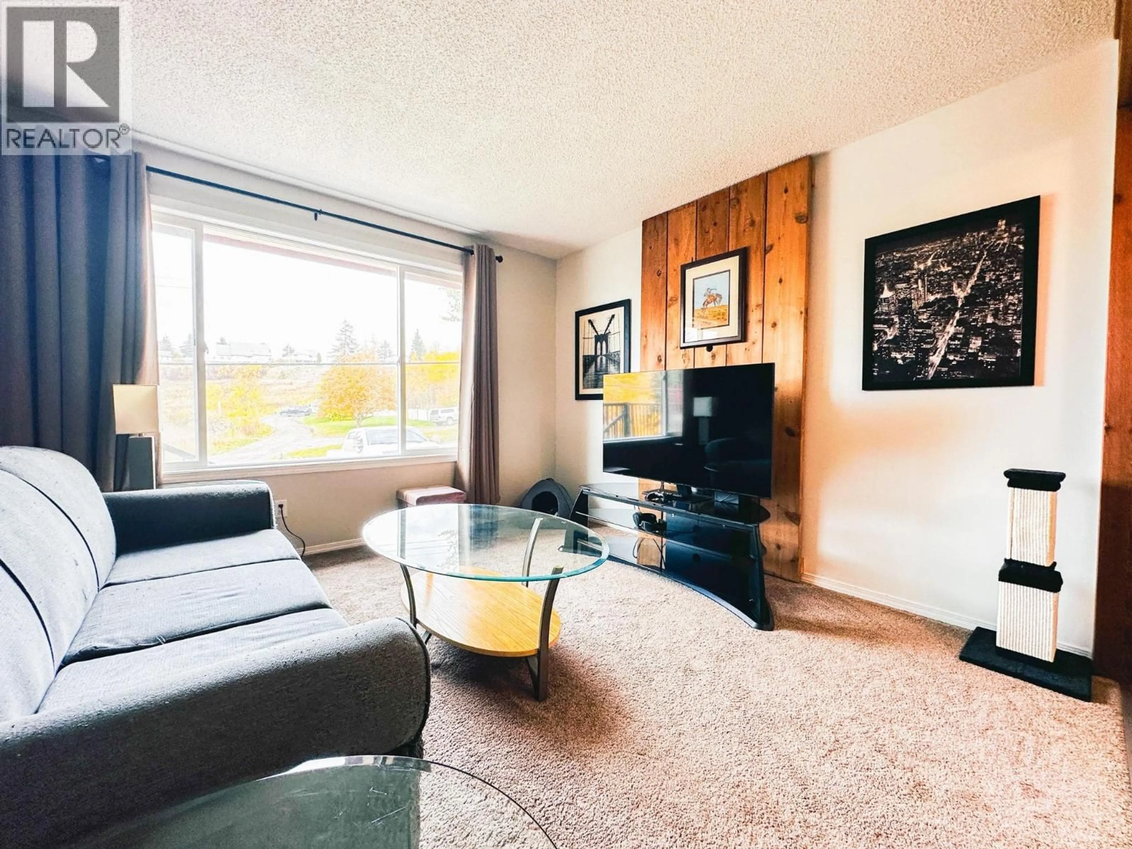 Living room with furniture, wood/laminate floor for 328 1ST AVENUE, Burns Lake British Columbia V0J1E0
