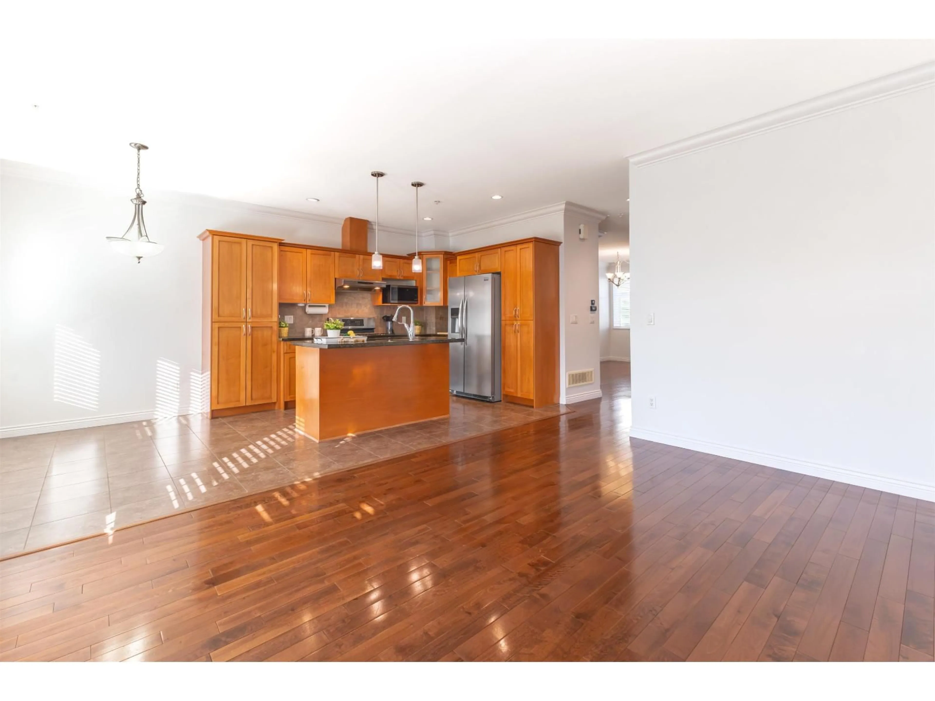 Open concept kitchen, wood/laminate floor for 36 - 21704 96 AVENUE, Langley British Columbia V1M0A8