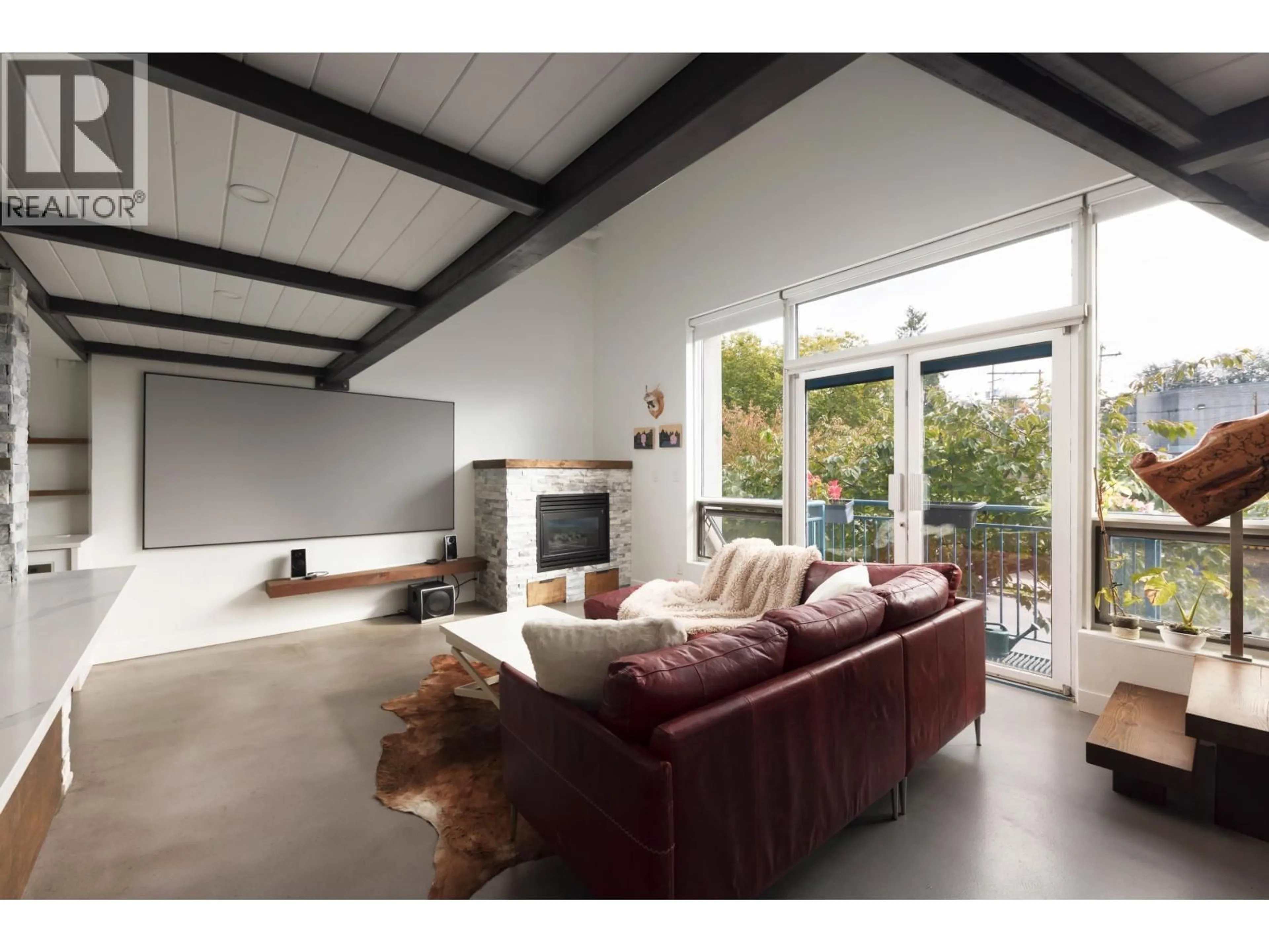Living room with furniture, cement floor for 207 - 2001 WALL STREET, Vancouver British Columbia V5L5E4