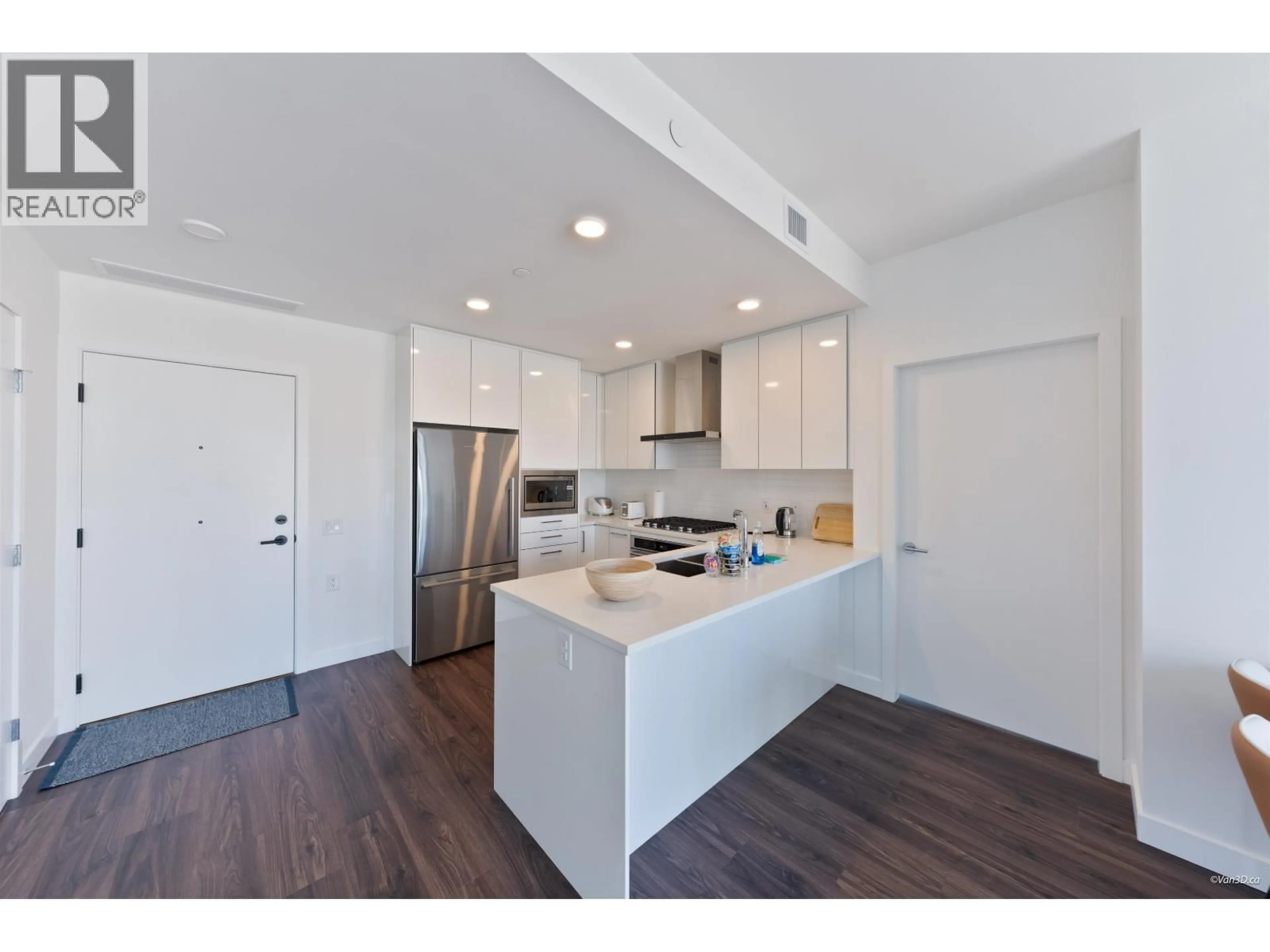 Open concept kitchen, wood/laminate floor for 1702 - 518 CLARKE ROAD, Coquitlam British Columbia V3J3X2
