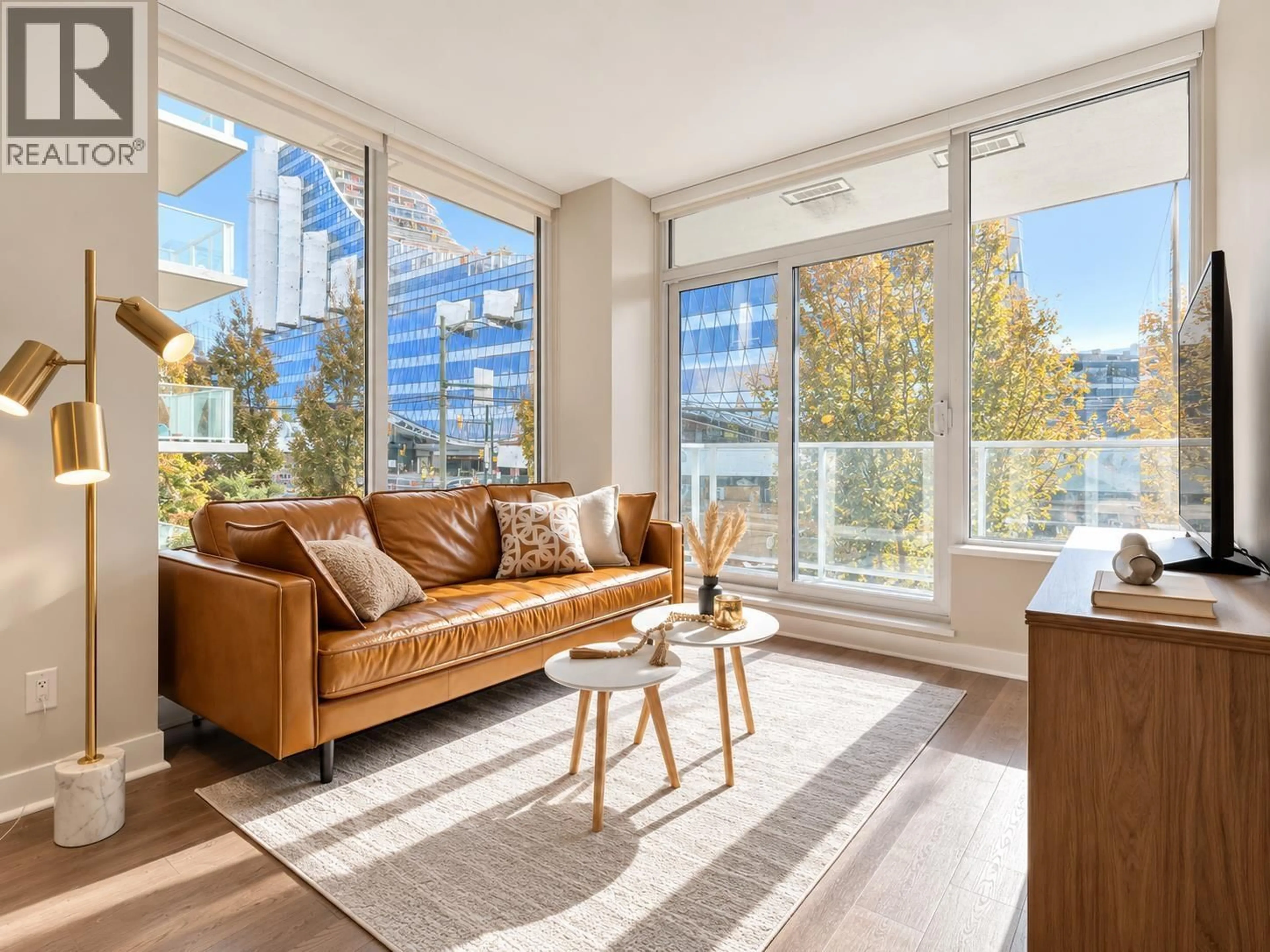 Living room with furniture, wood/laminate floor for 211 - 677 41ST AVENUE, Vancouver British Columbia V5Z2N1
