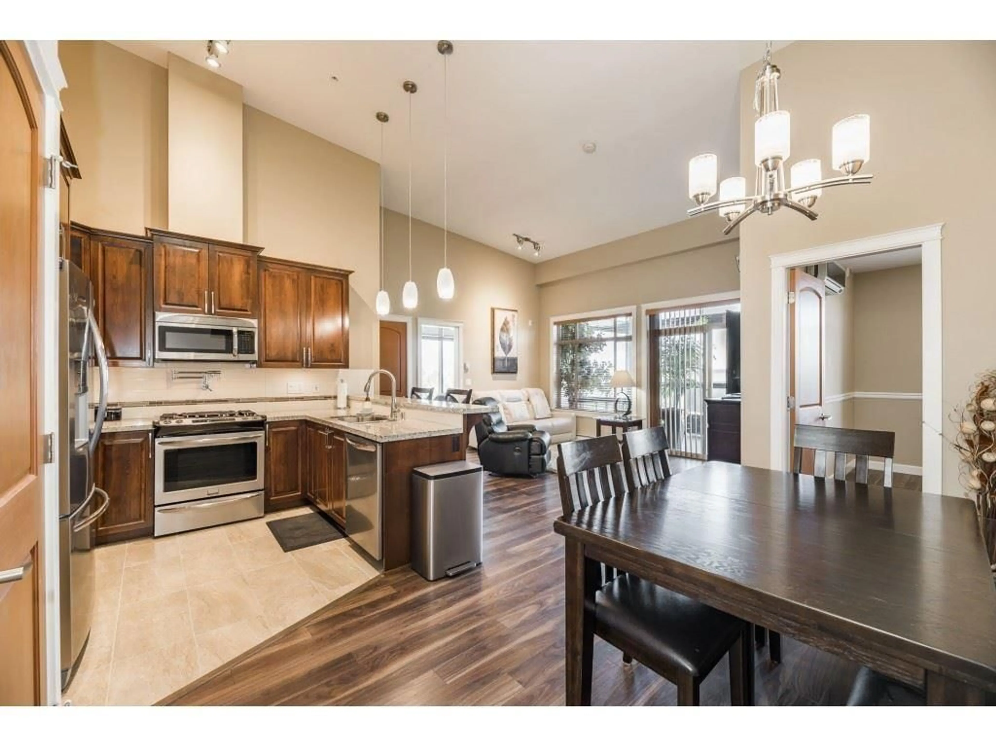 Open concept kitchen, unknown for 606 - 2860 TRETHEWEY STREET, Abbotsford British Columbia V2T0G5