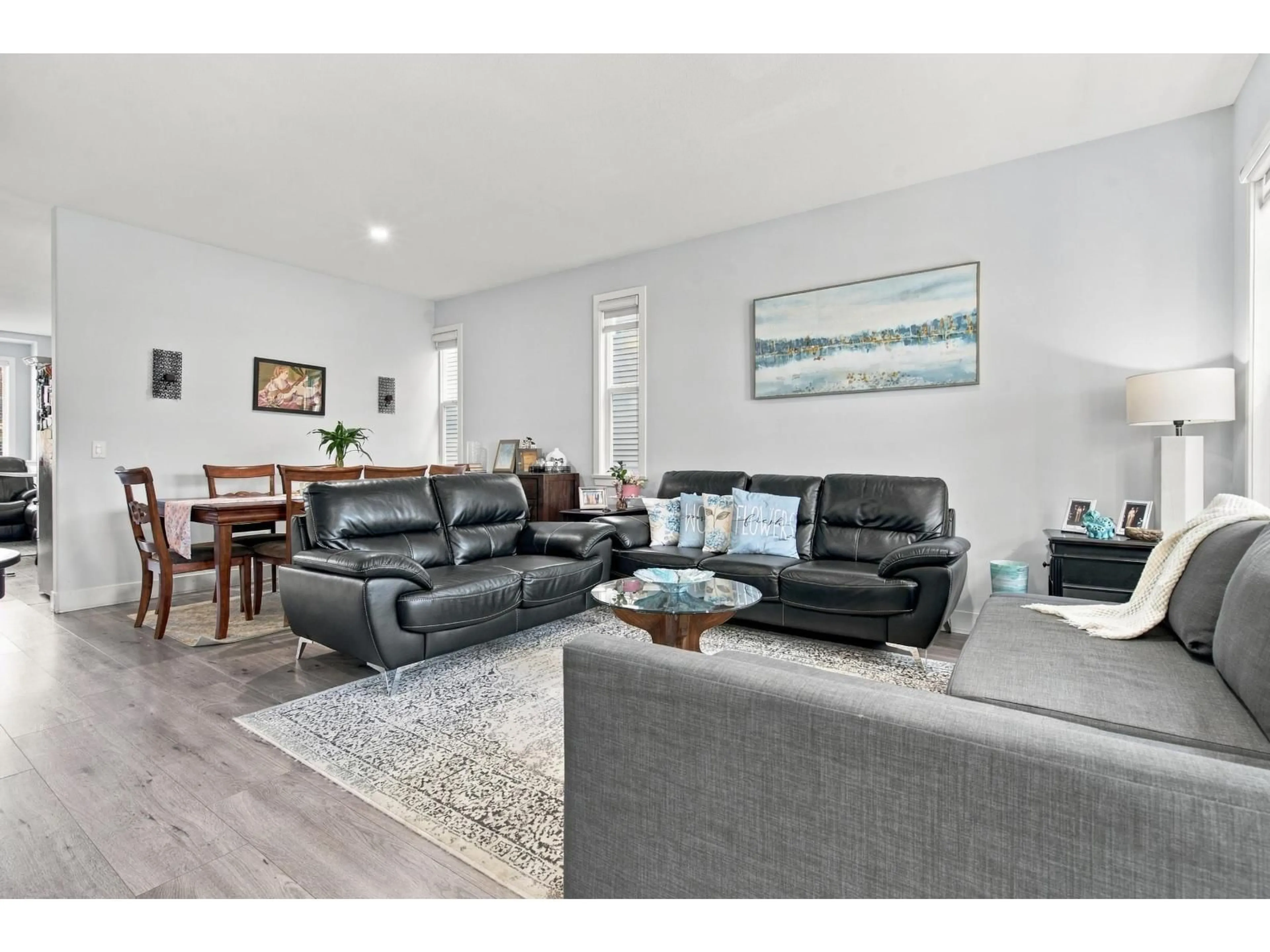 Living room with furniture, wood/laminate floor for 6926 190 STREET, Surrey British Columbia V4N5P1
