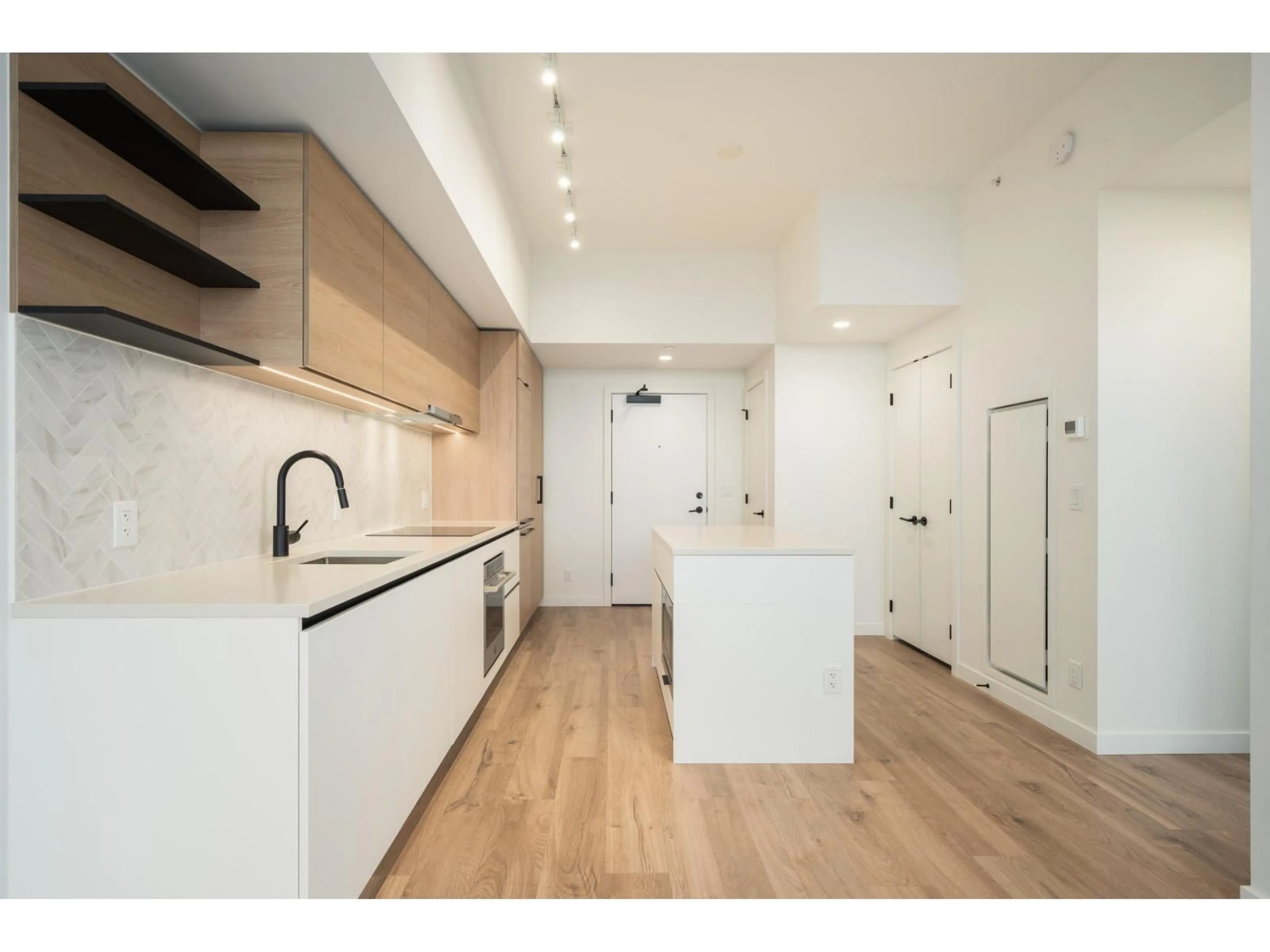 Open concept kitchen, wood/laminate floor for 2611 - 13428 105 AVENUE, Surrey British Columbia V3T0S6