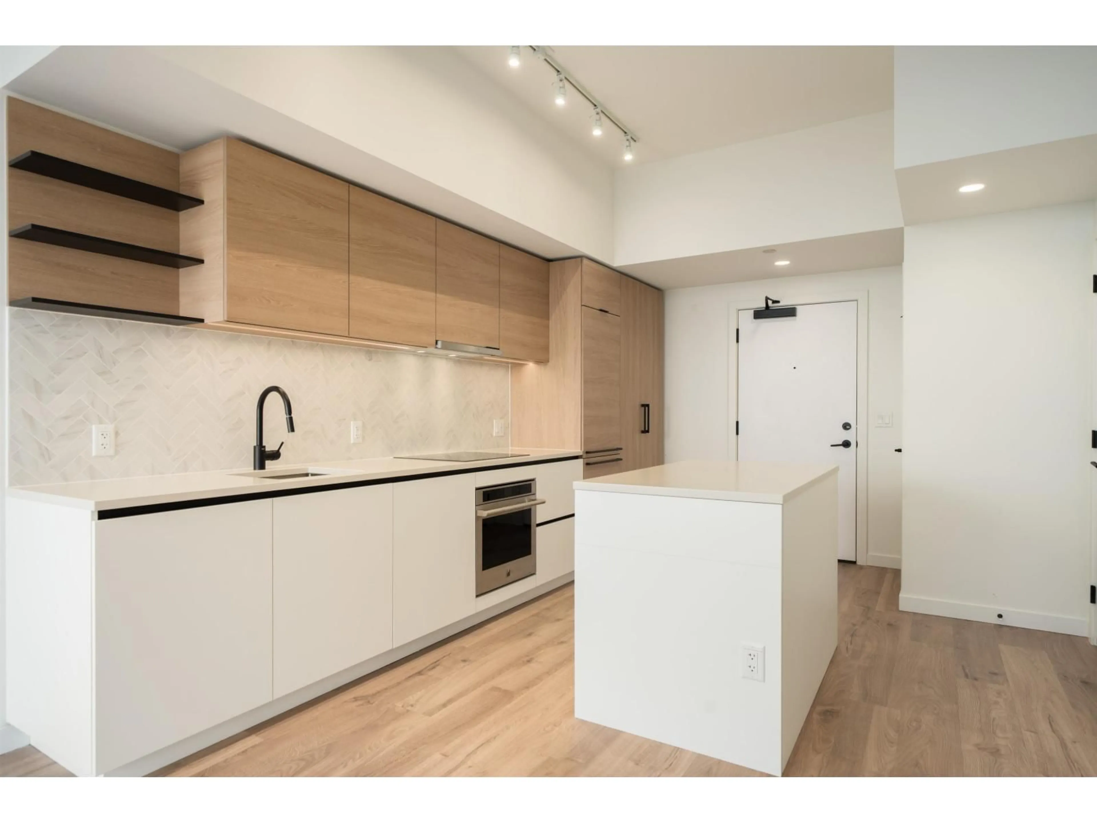 Open concept kitchen, wood/laminate floor for 2611 - 13428 105 AVENUE, Surrey British Columbia V3T0S6