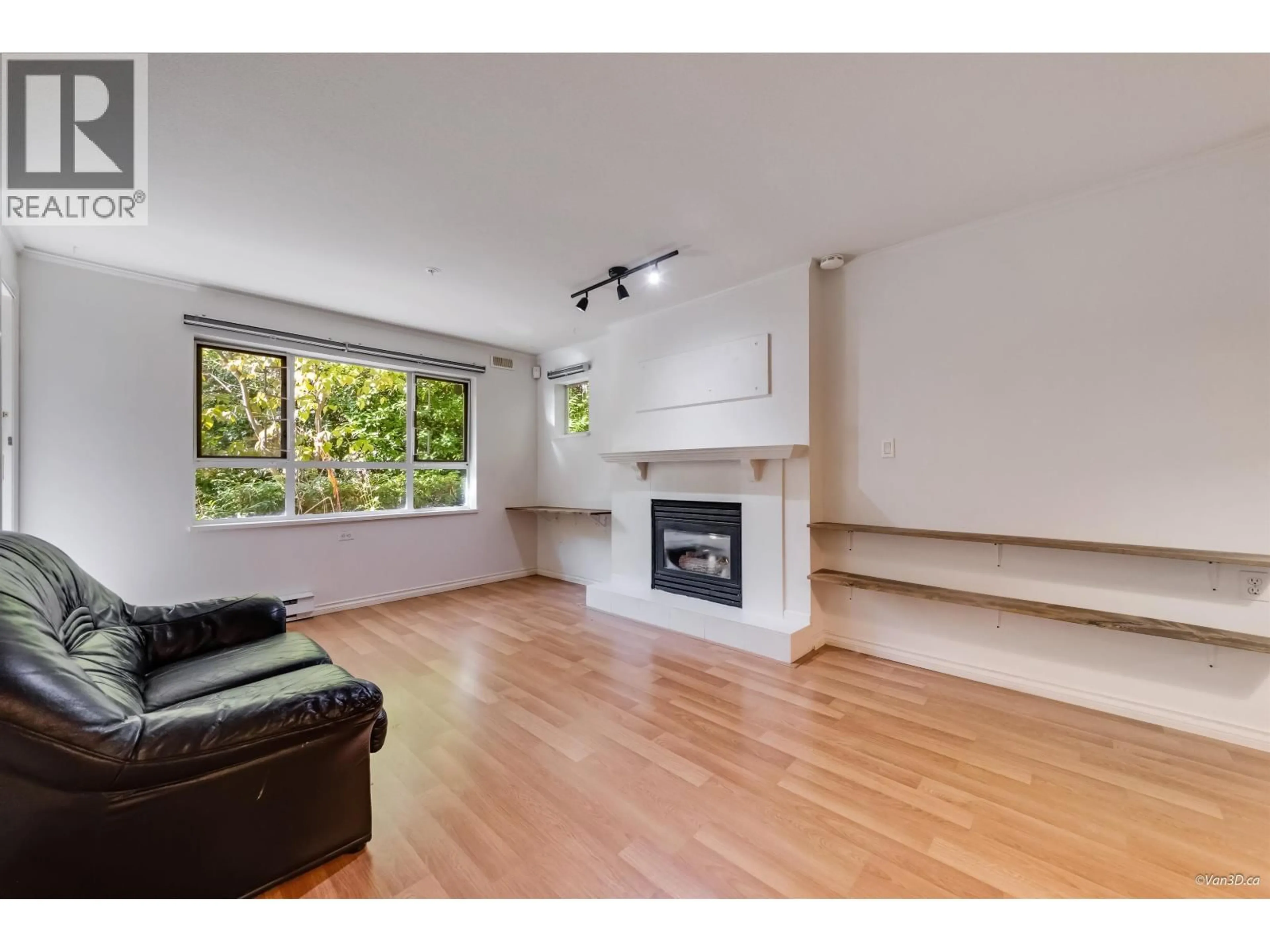 Living room with furniture, wood/laminate floor for 105 - 5577 SMITH AVENUE, Burnaby British Columbia V5H2K7