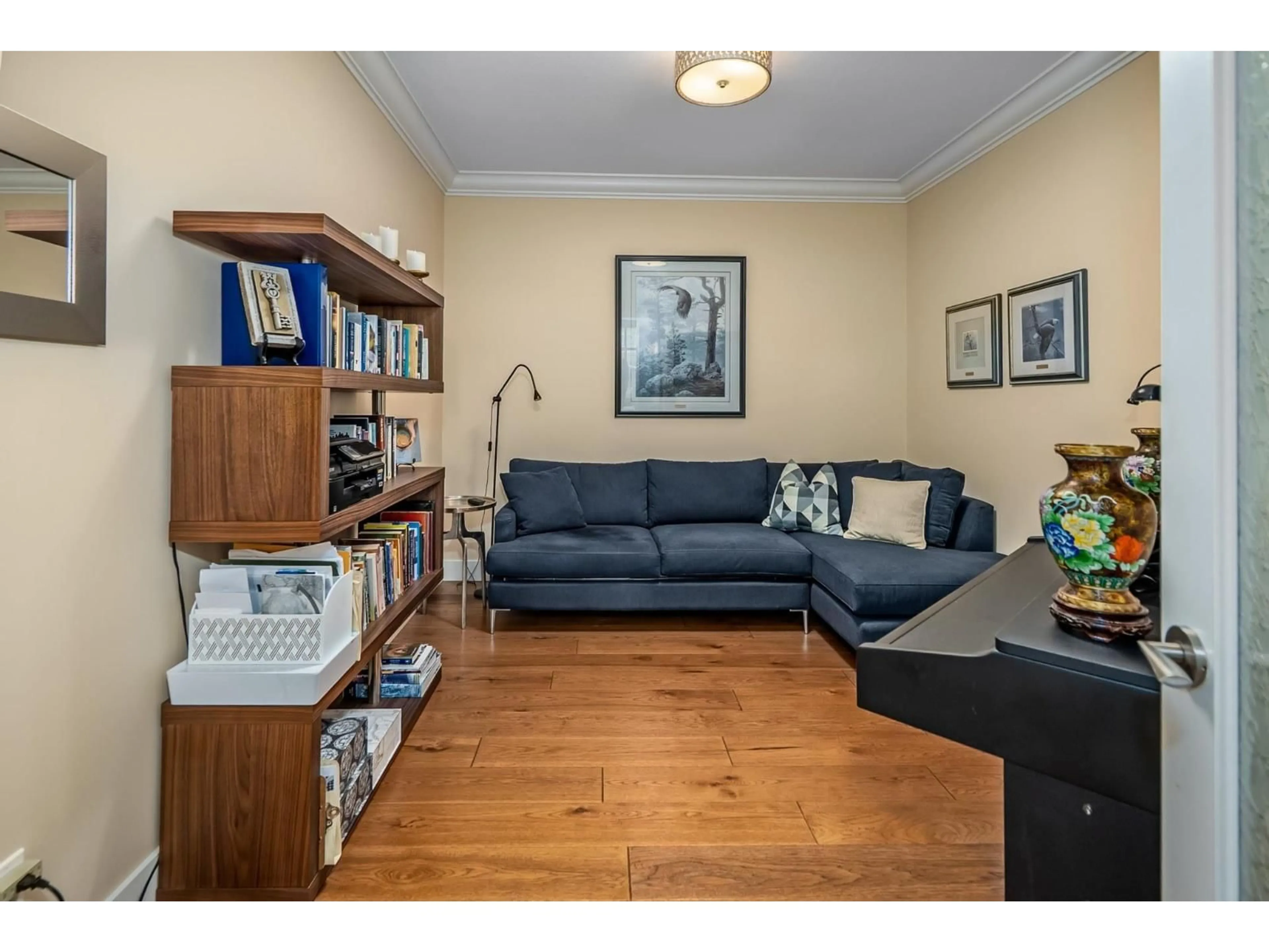 Living room with furniture, wood/laminate floor for 101 - 16455 64 AVENUE, Surrey British Columbia V2S6V7