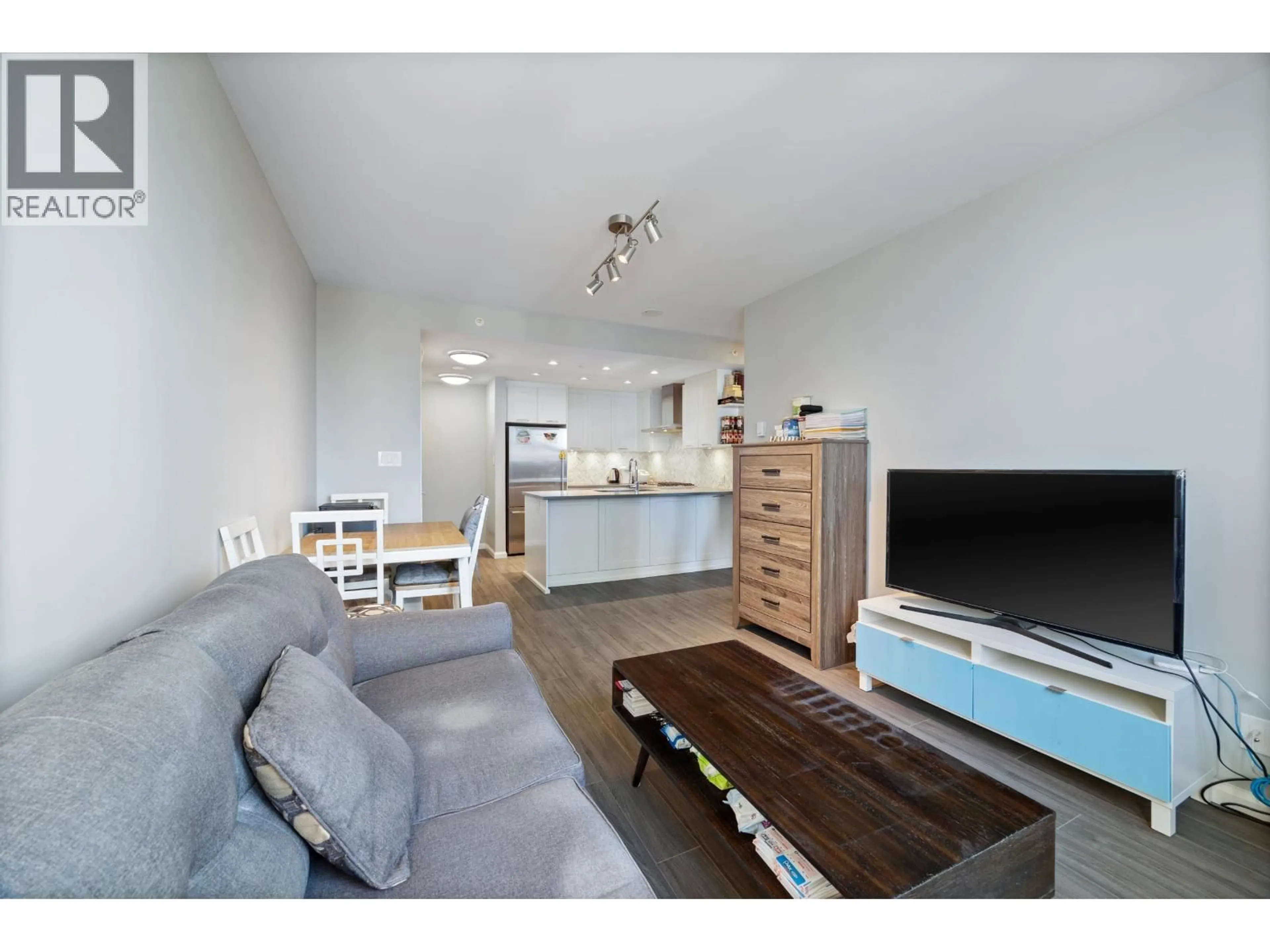 Living room with furniture, wood/laminate floor for 1401 - 520 COMO LAKE AVENUE, Coquitlam British Columbia V3J0E8