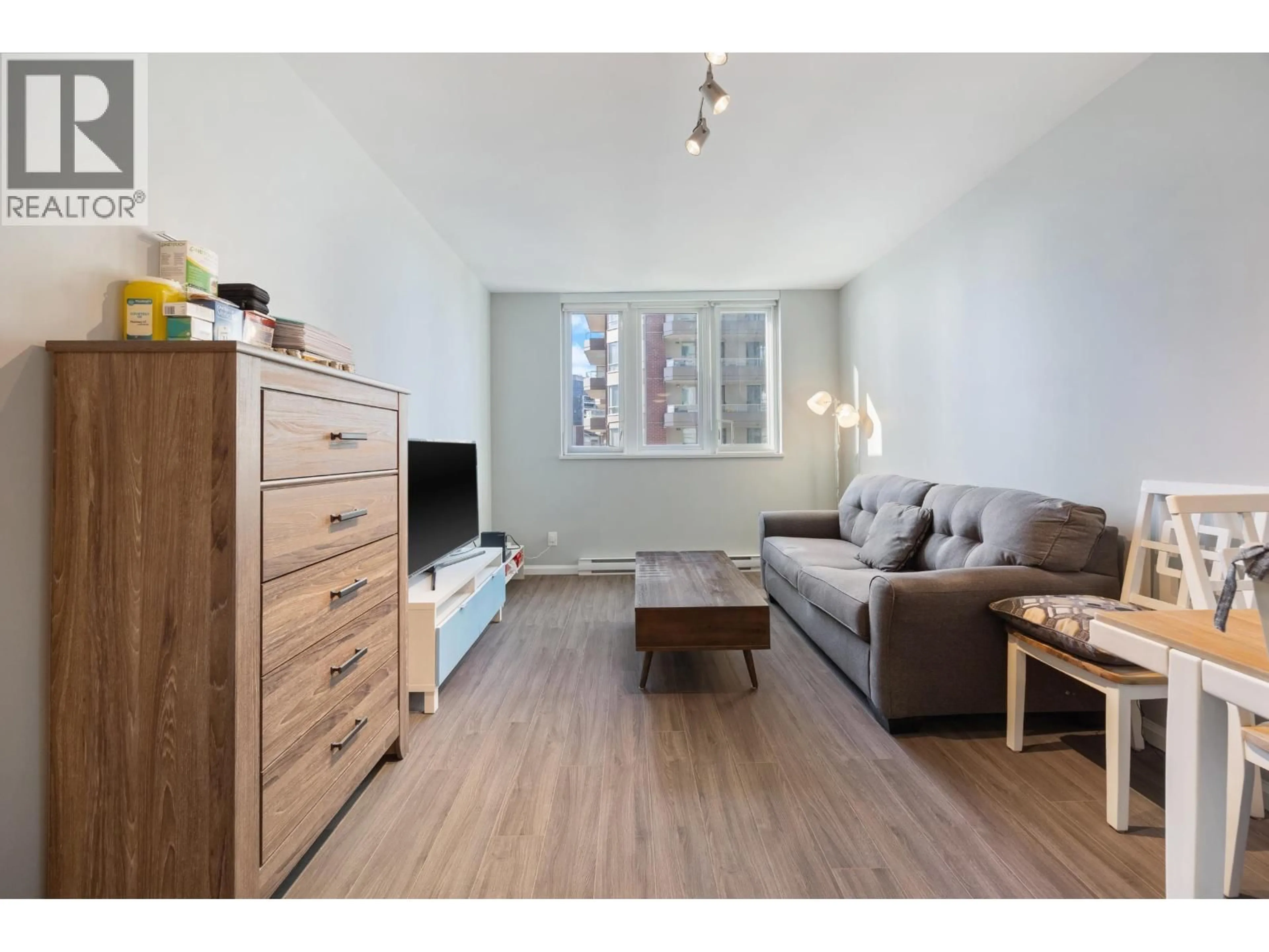 Living room with furniture, wood/laminate floor for 1401 - 520 COMO LAKE AVENUE, Coquitlam British Columbia V3J0E8