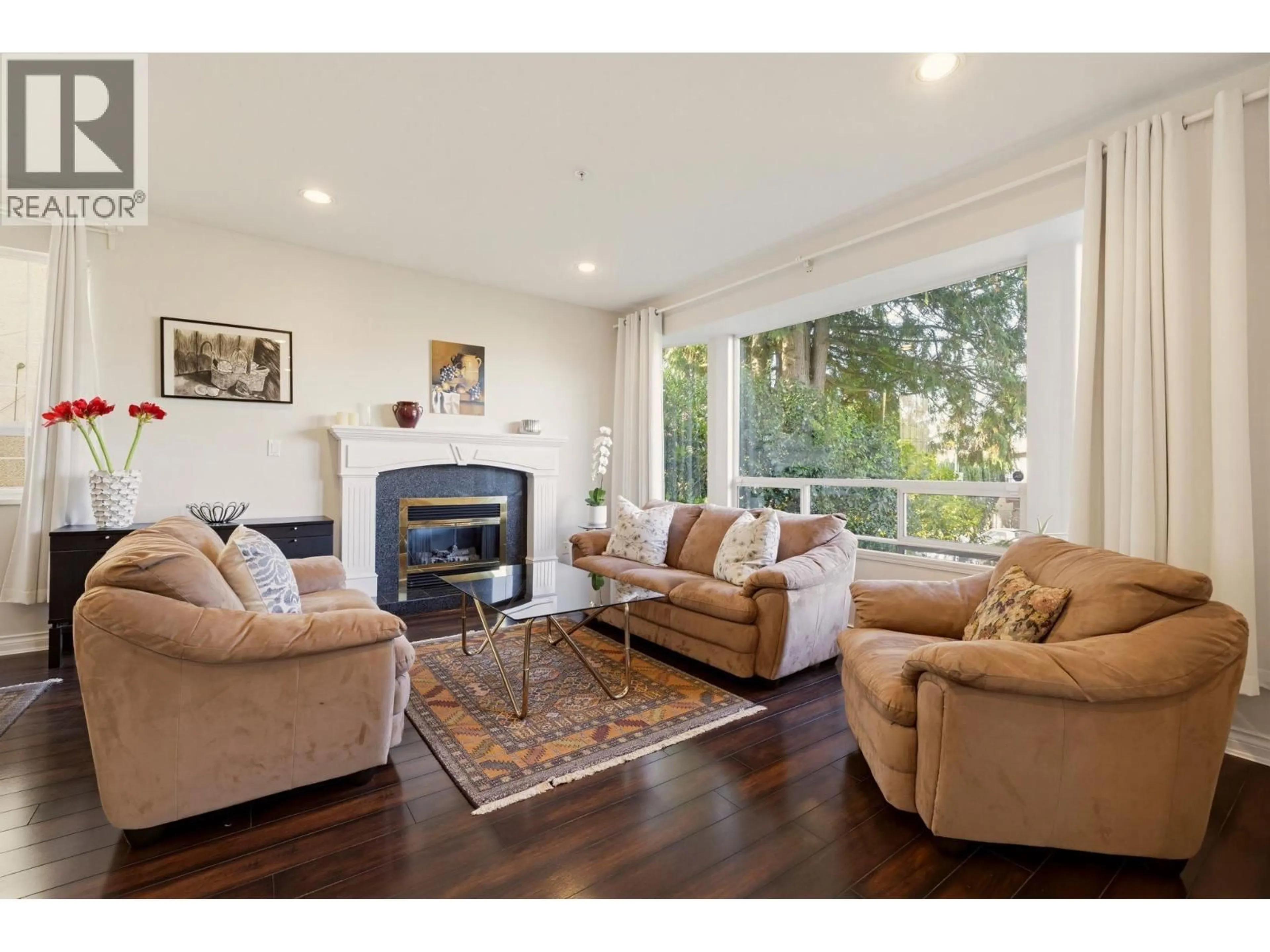 Living room with furniture, wood/laminate floor for 5454 INVERNESS STREET, Vancouver British Columbia V5W3P1