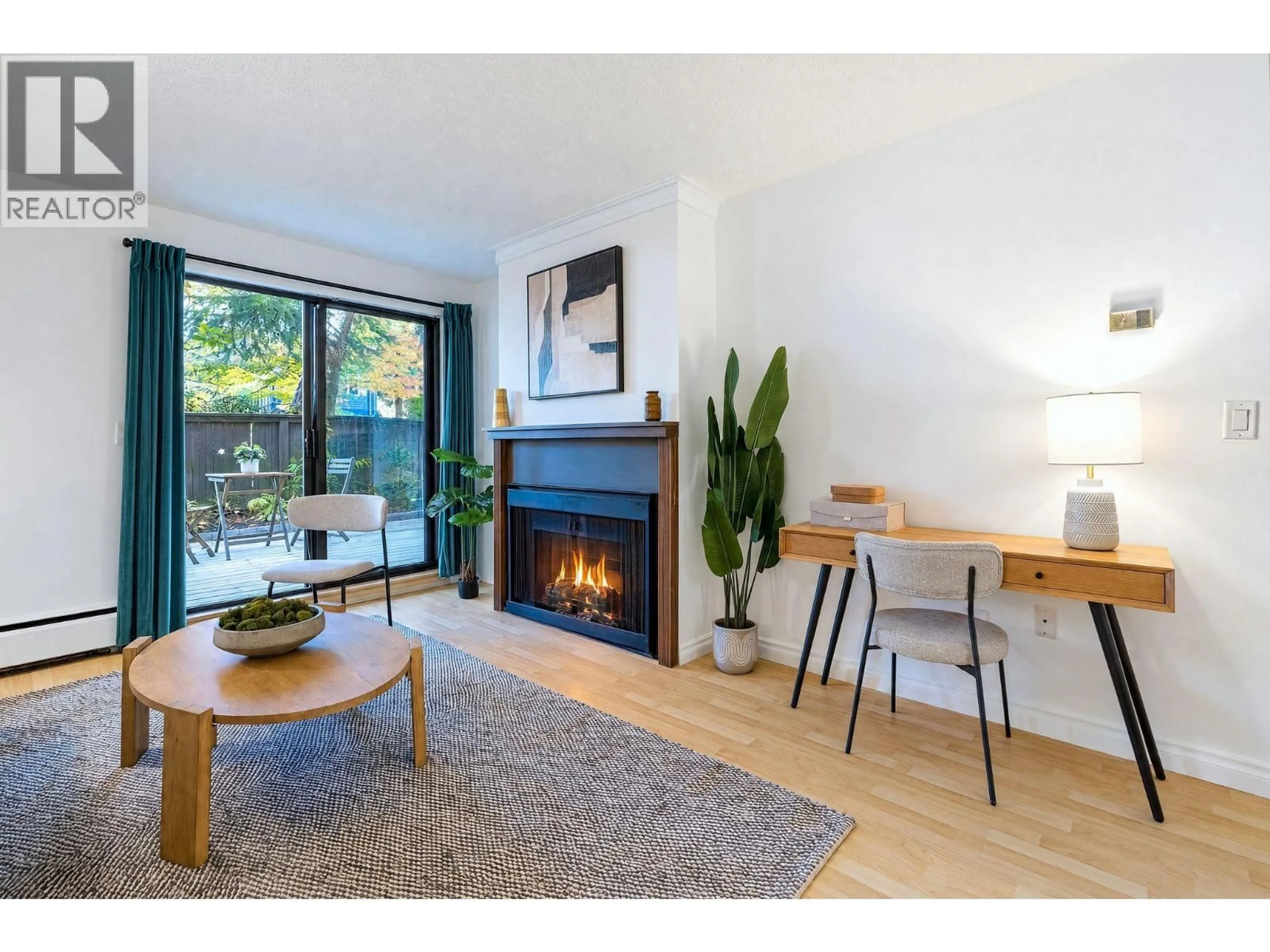 Living room with furniture, wood/laminate floor for 102 - 1420 7TH AVENUE, Vancouver British Columbia V5N1R8
