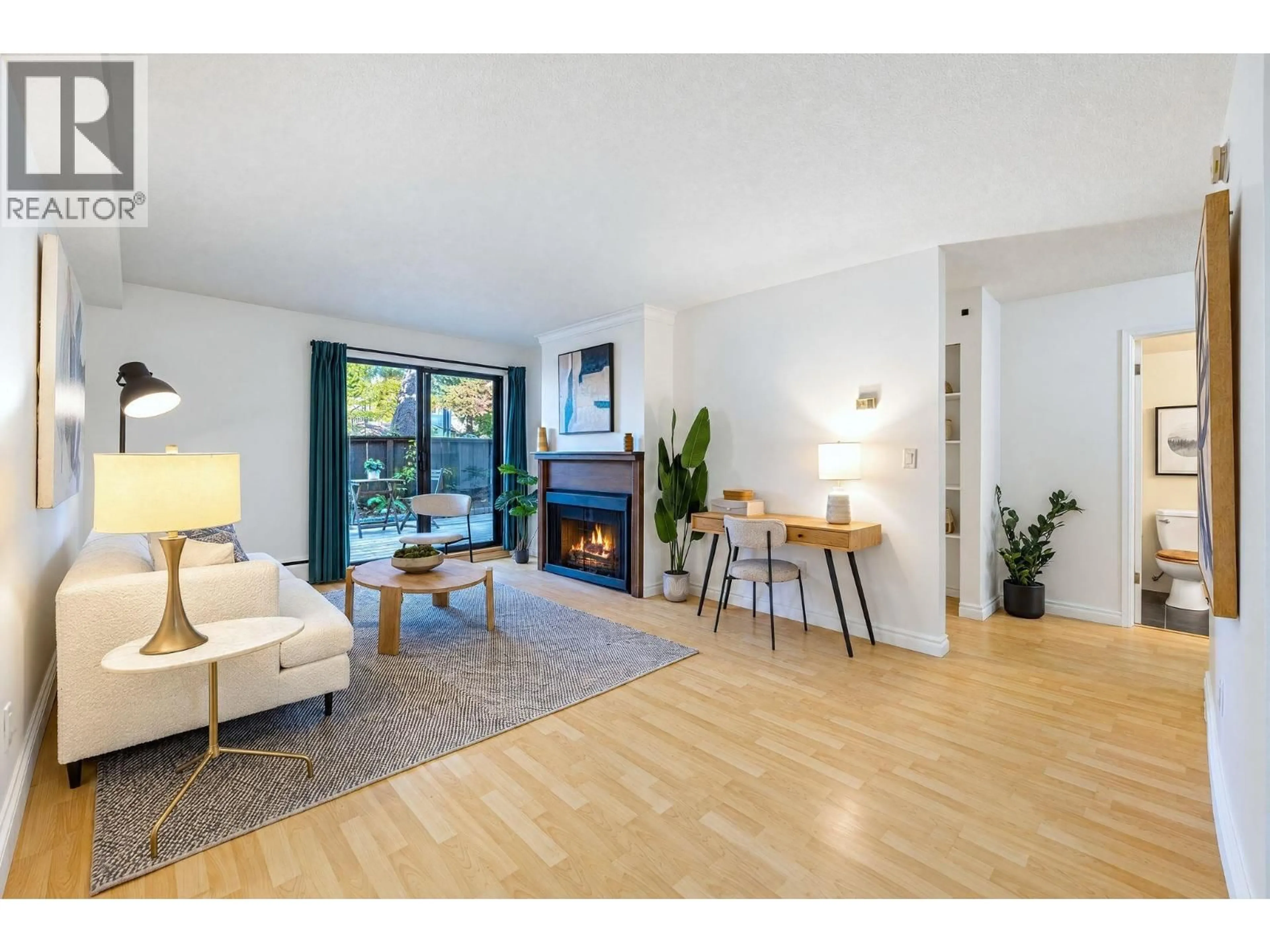 Living room with furniture, wood/laminate floor for 102 - 1420 7TH AVENUE, Vancouver British Columbia V5N1R8