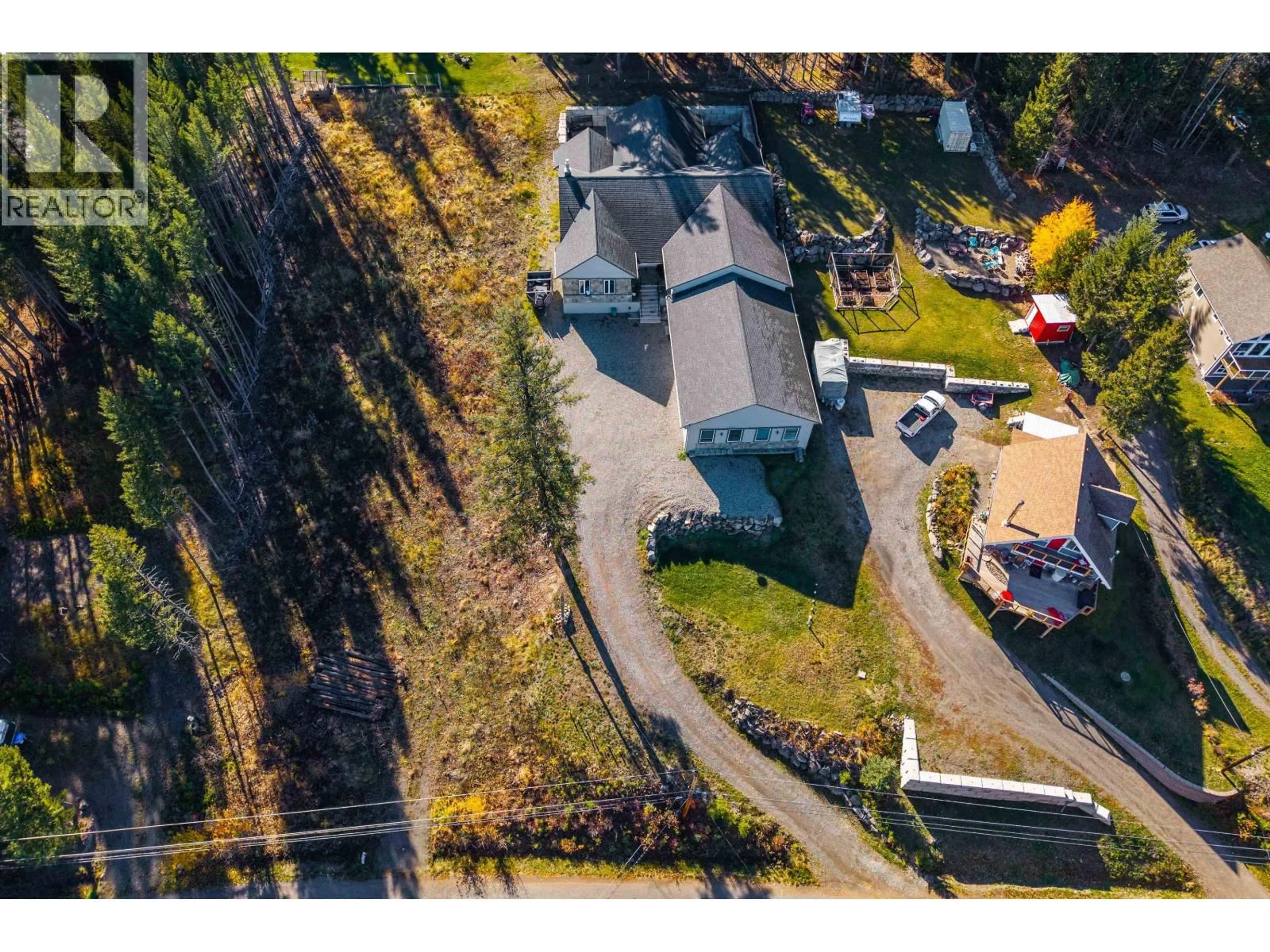 A pic from outside/outdoor area/front of a property/back of a property/a pic from drone, unknown for 6296 MULLIGAN DRIVE, Horse Lake British Columbia V0K2E3