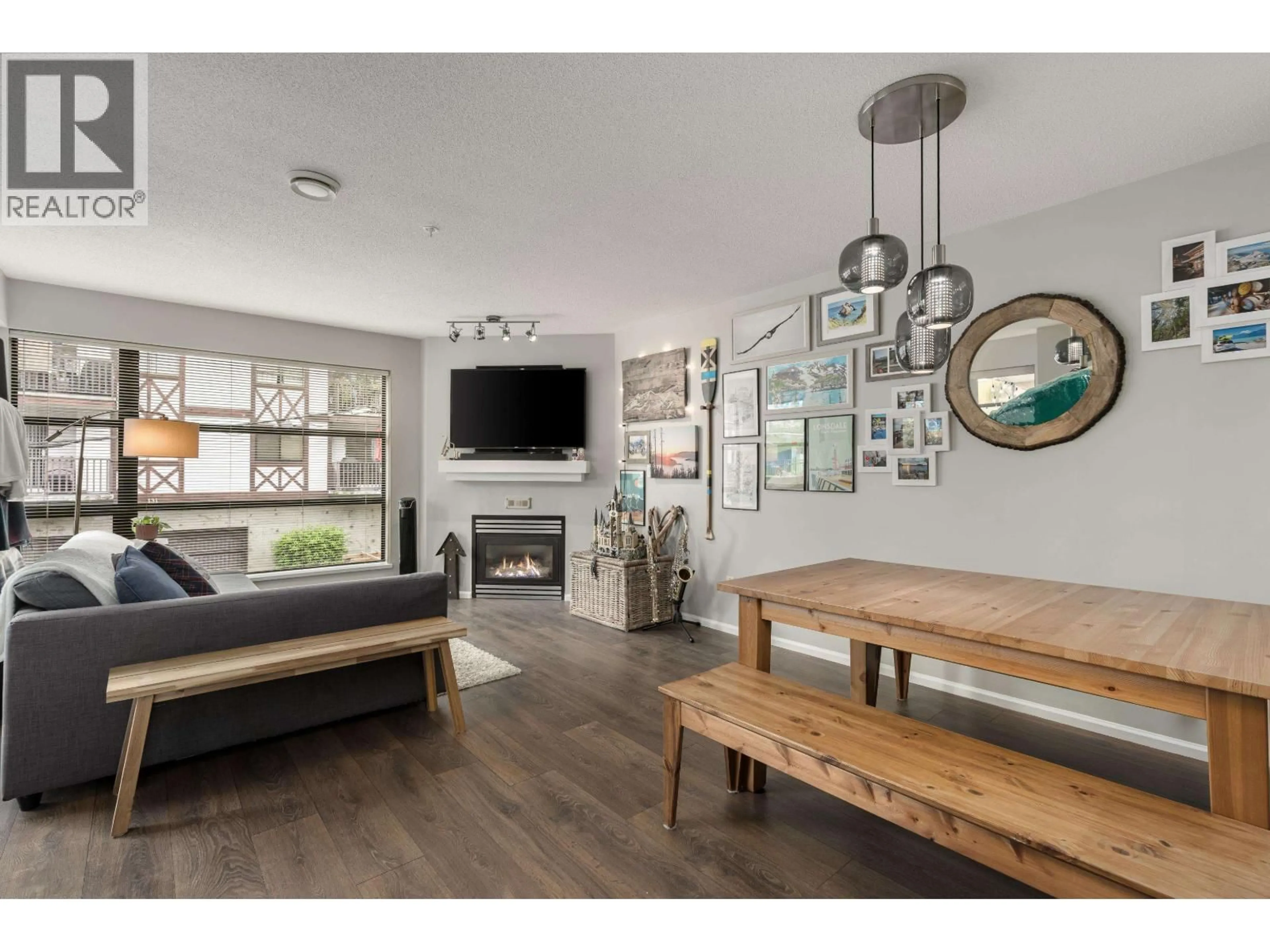 Living room with furniture, wood/laminate floor for 305 - 124 3RD STREET, North Vancouver British Columbia V7M1E8