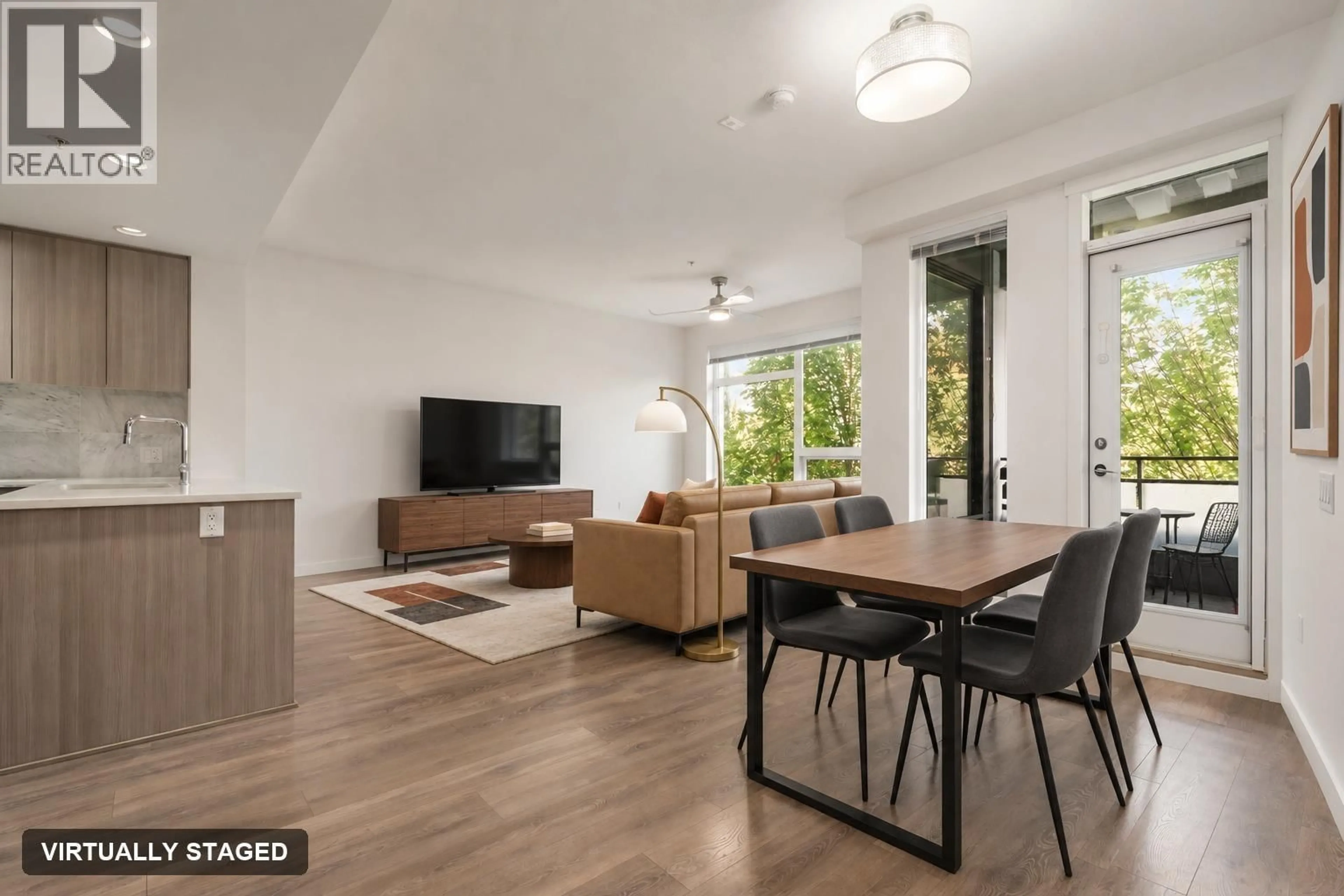Living room with furniture, wood/laminate floor for 214 - 3289 RIVERWALK AVENUE, Vancouver British Columbia V5S0G2