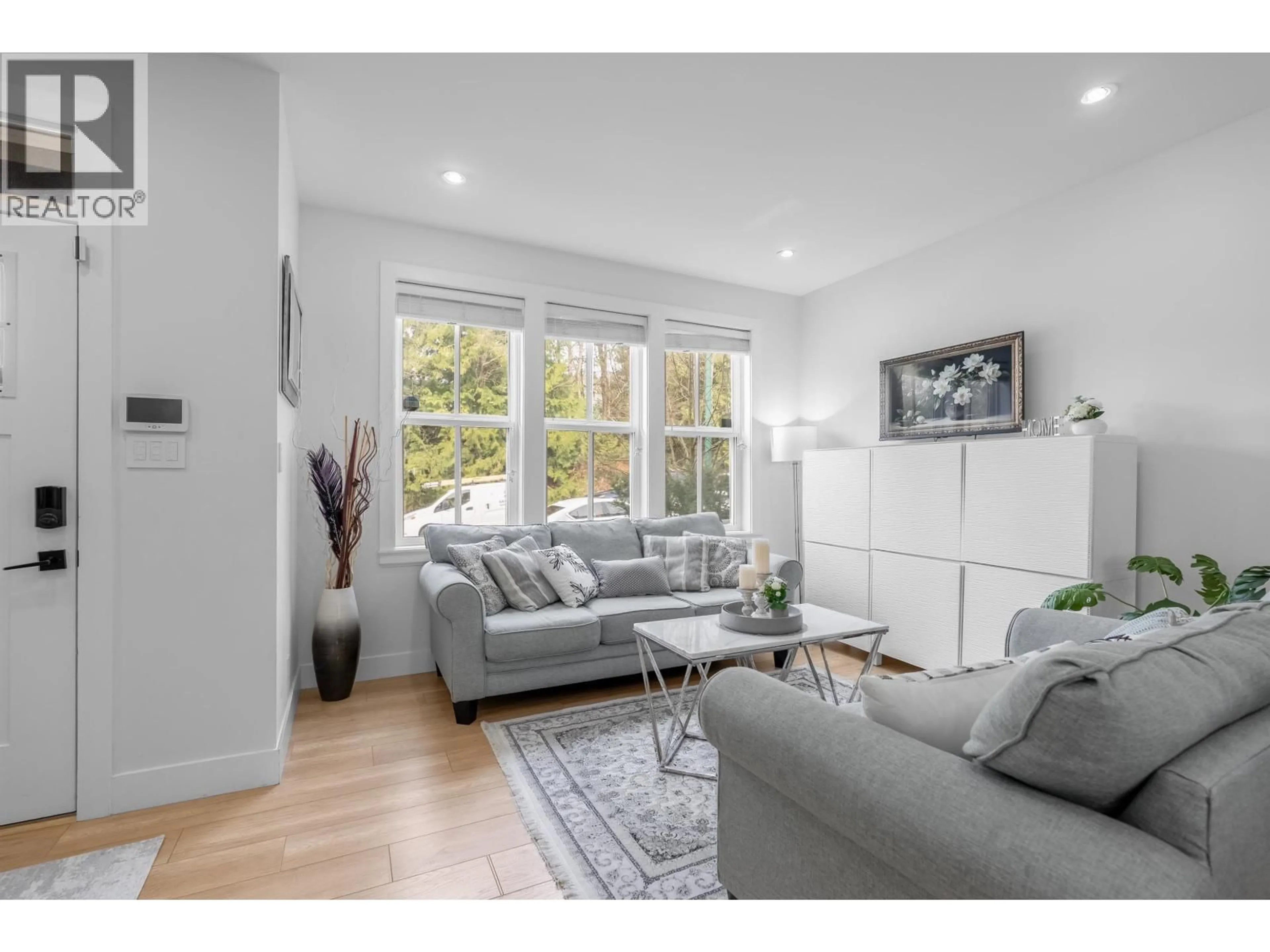 Living room with furniture, unknown for 101 - 3416 QUEENSTON AVENUE, Coquitlam British Columbia V3E3H1