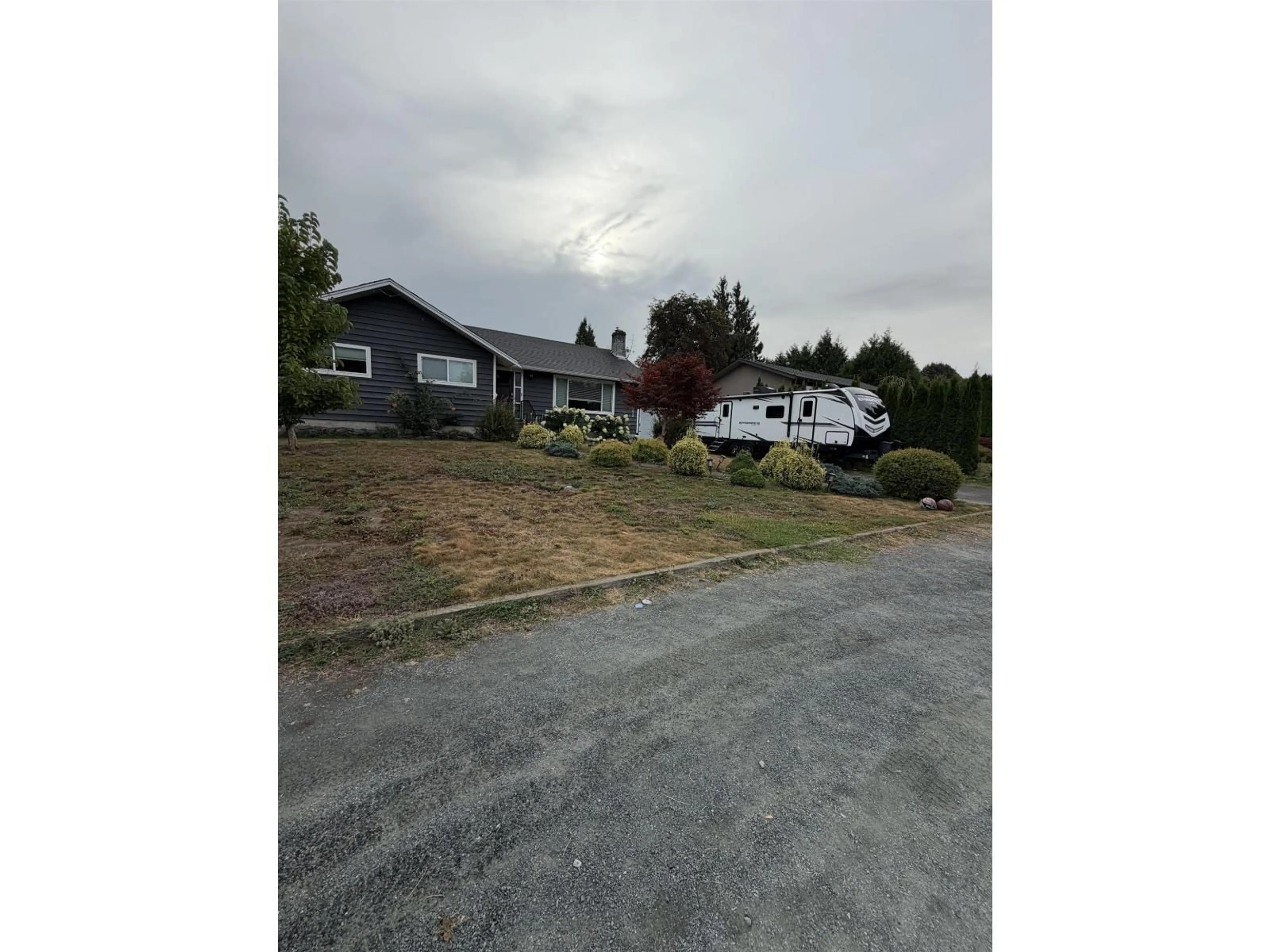 A pic from outside/outdoor area/front of a property/back of a property/a pic from drone, street for 6992 CENTENNIAL DRIVE, Chilliwack British Columbia V2R4C7