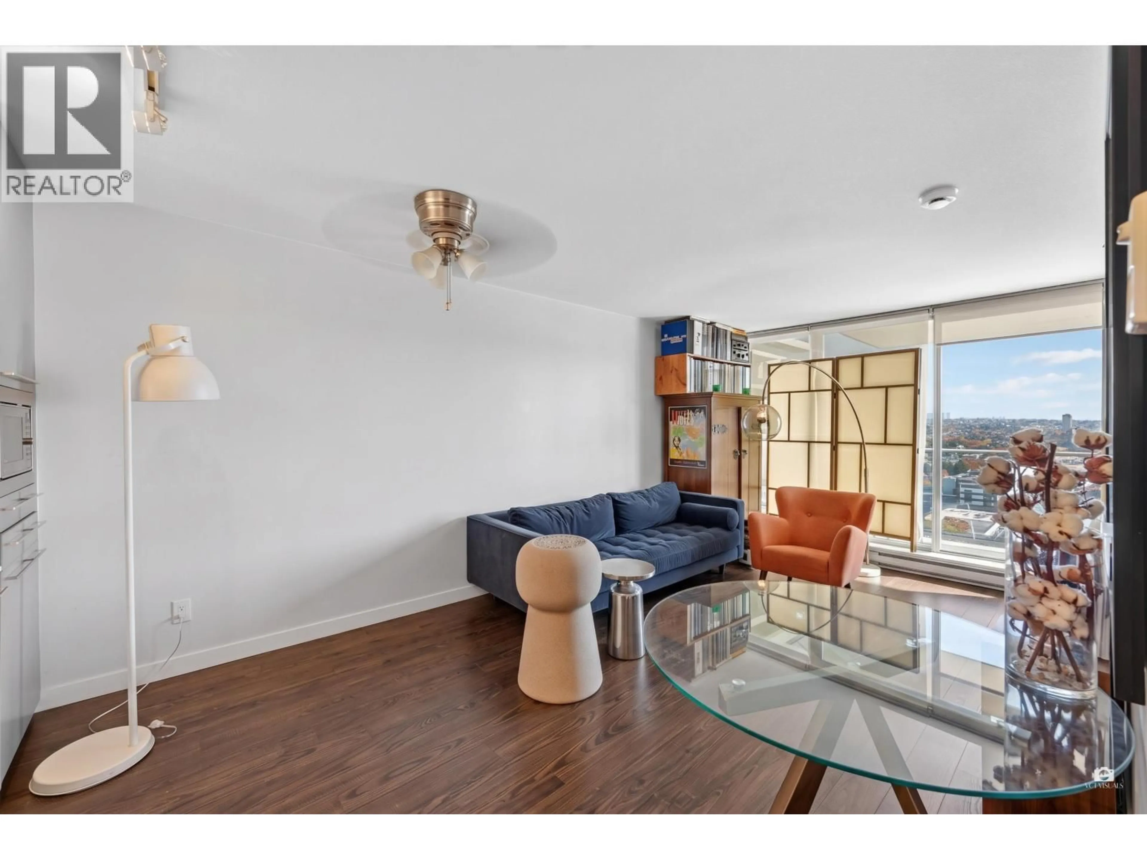 Living room with furniture, wood/laminate floor for 2506 - 8131 NUNAVUT LANE, Vancouver British Columbia V5X0E2