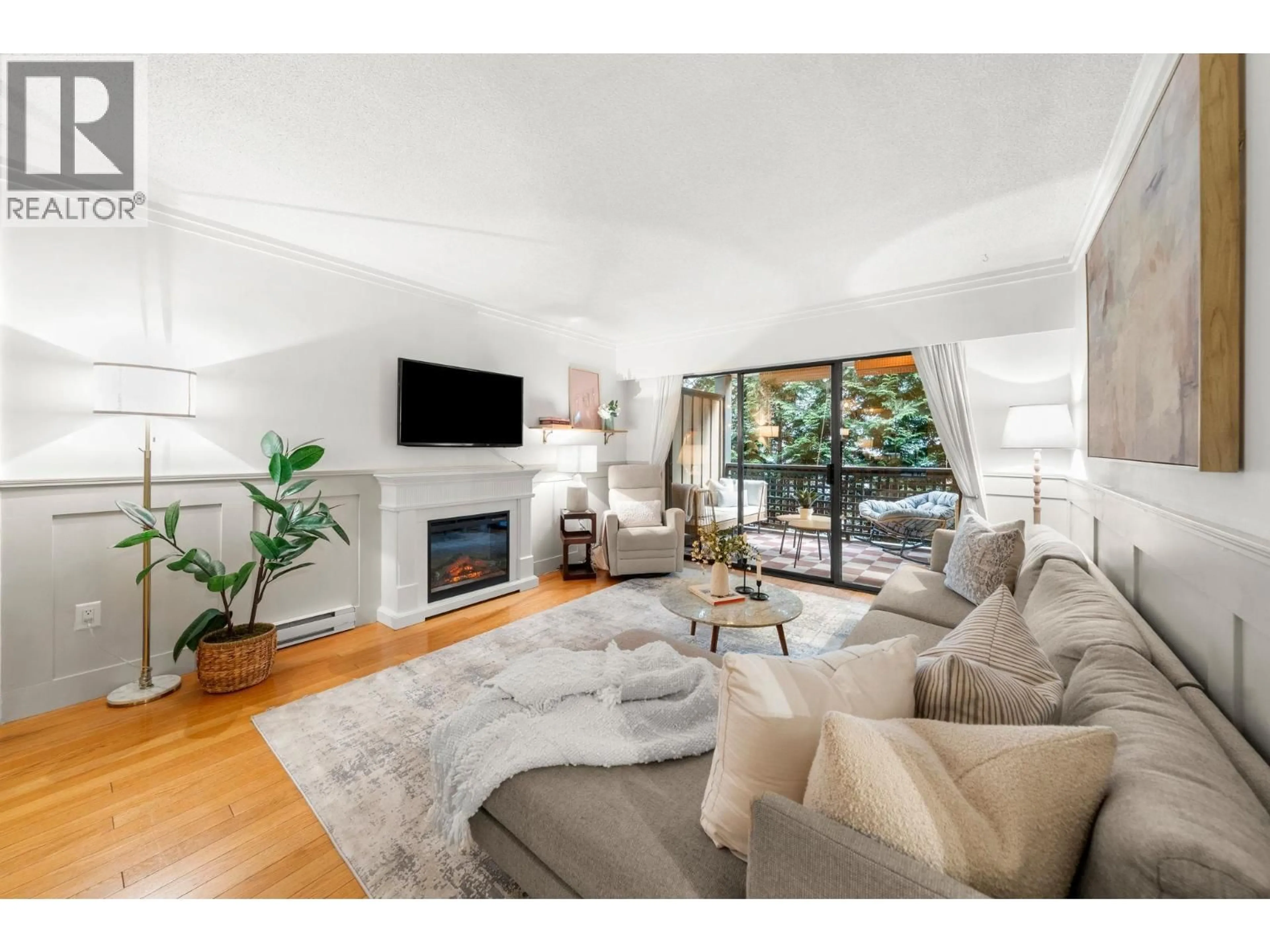 Living room with furniture, wood/laminate floor for 201 - 101 29TH STREET, North Vancouver British Columbia V7N1C5