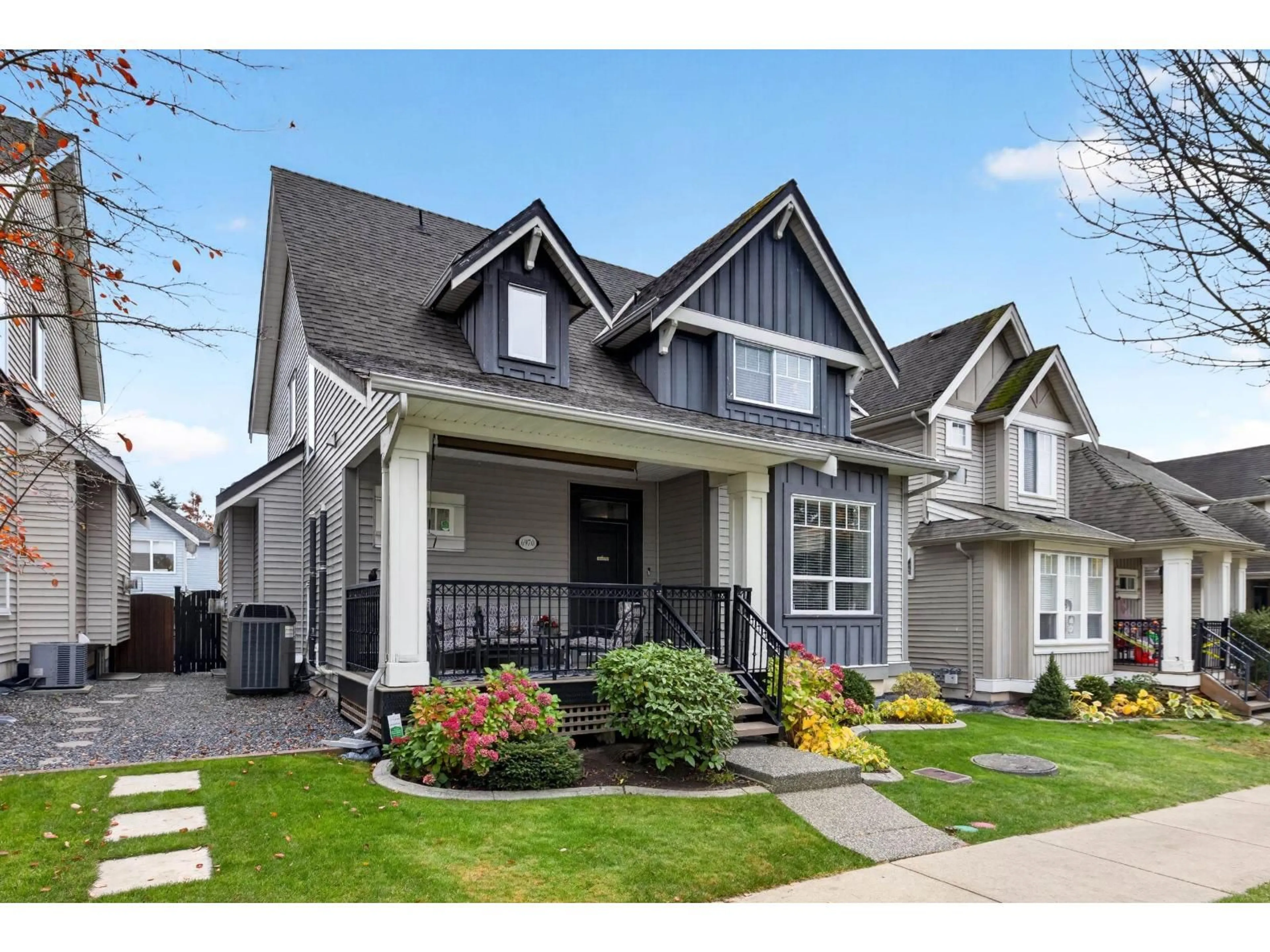 Home with vinyl exterior material, street for 6970 195A STREET, Surrey British Columbia V4N5Z2