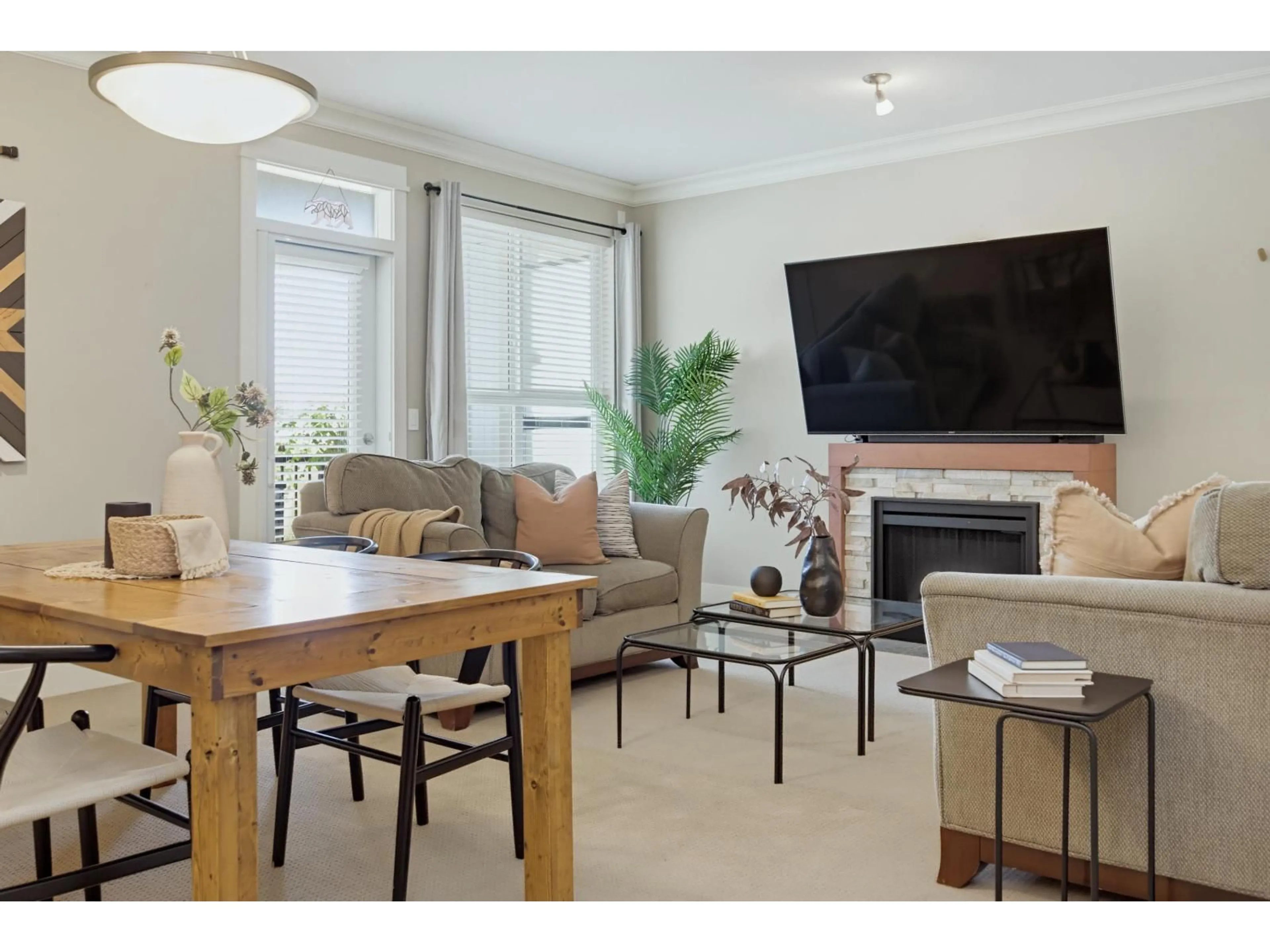 Living room with furniture, wood/laminate floor for 409 - 5430 201 STREET, Langley British Columbia V3A0A2
