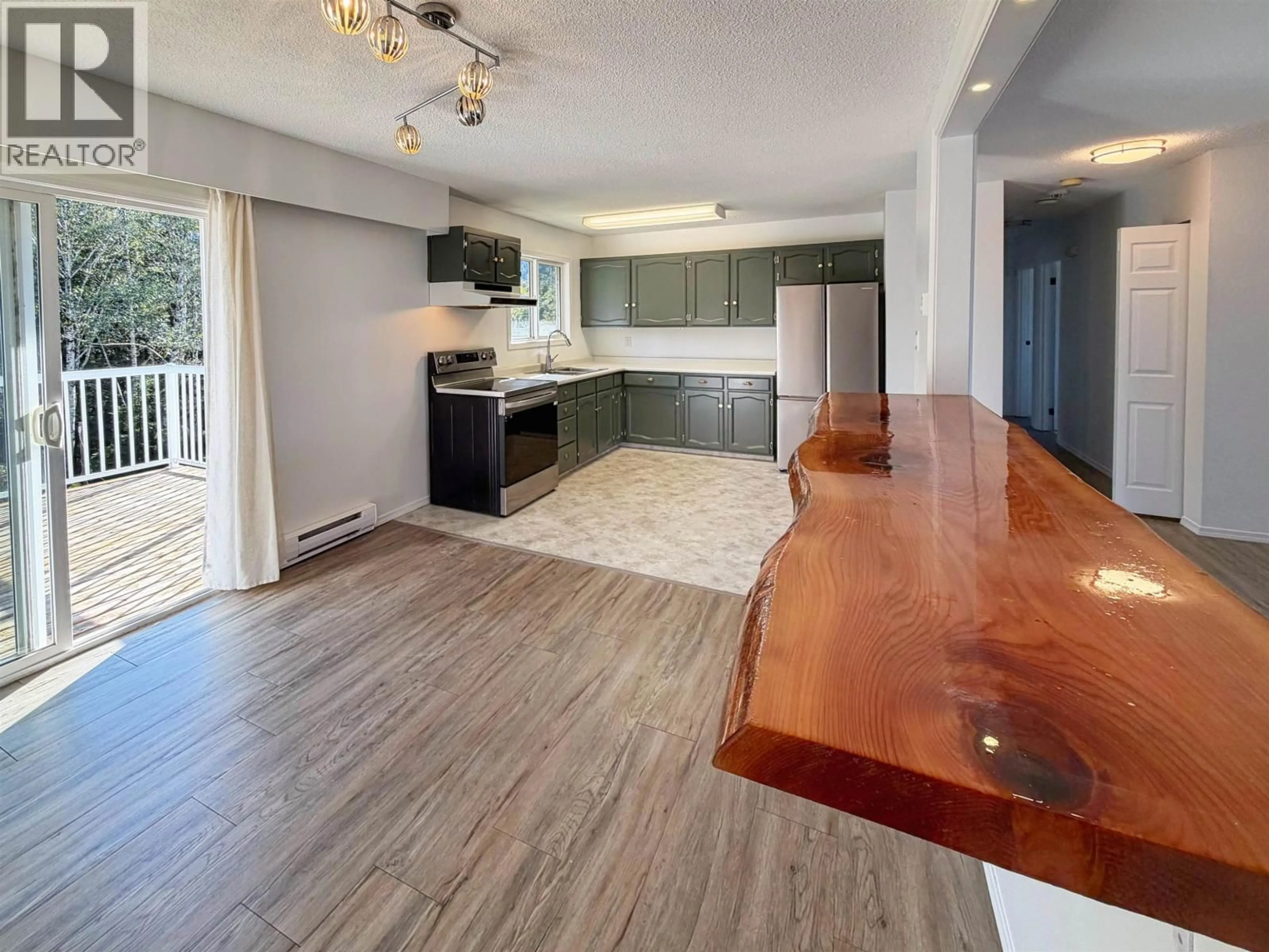 Open concept kitchen, wood/laminate floor for 1313 OMINECA AVENUE, Prince Rupert British Columbia V8J2B9