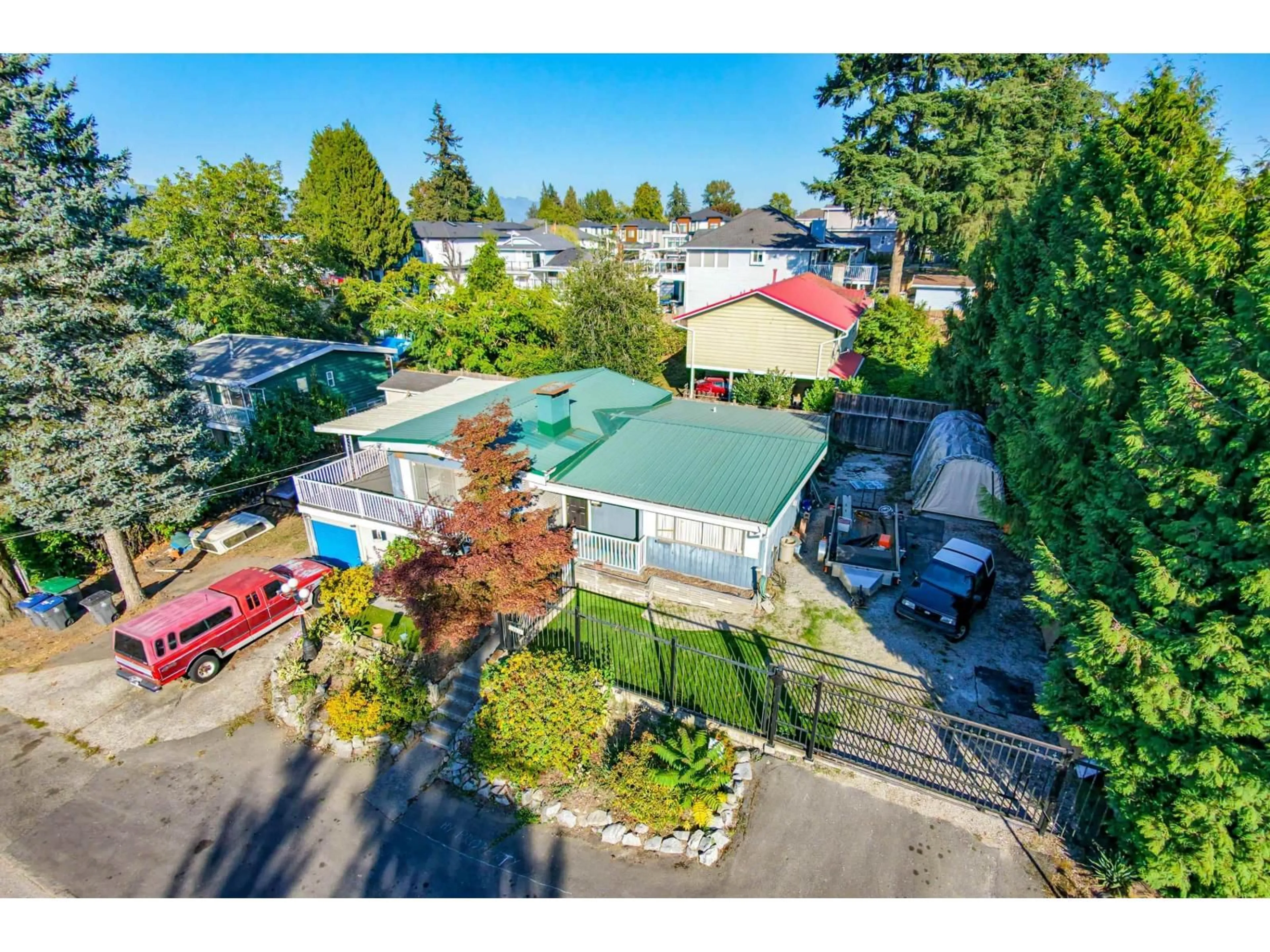 A pic from outside/outdoor area/front of a property/back of a property/a pic from drone, street for 10810 129 STREET, Surrey British Columbia V3T3H8