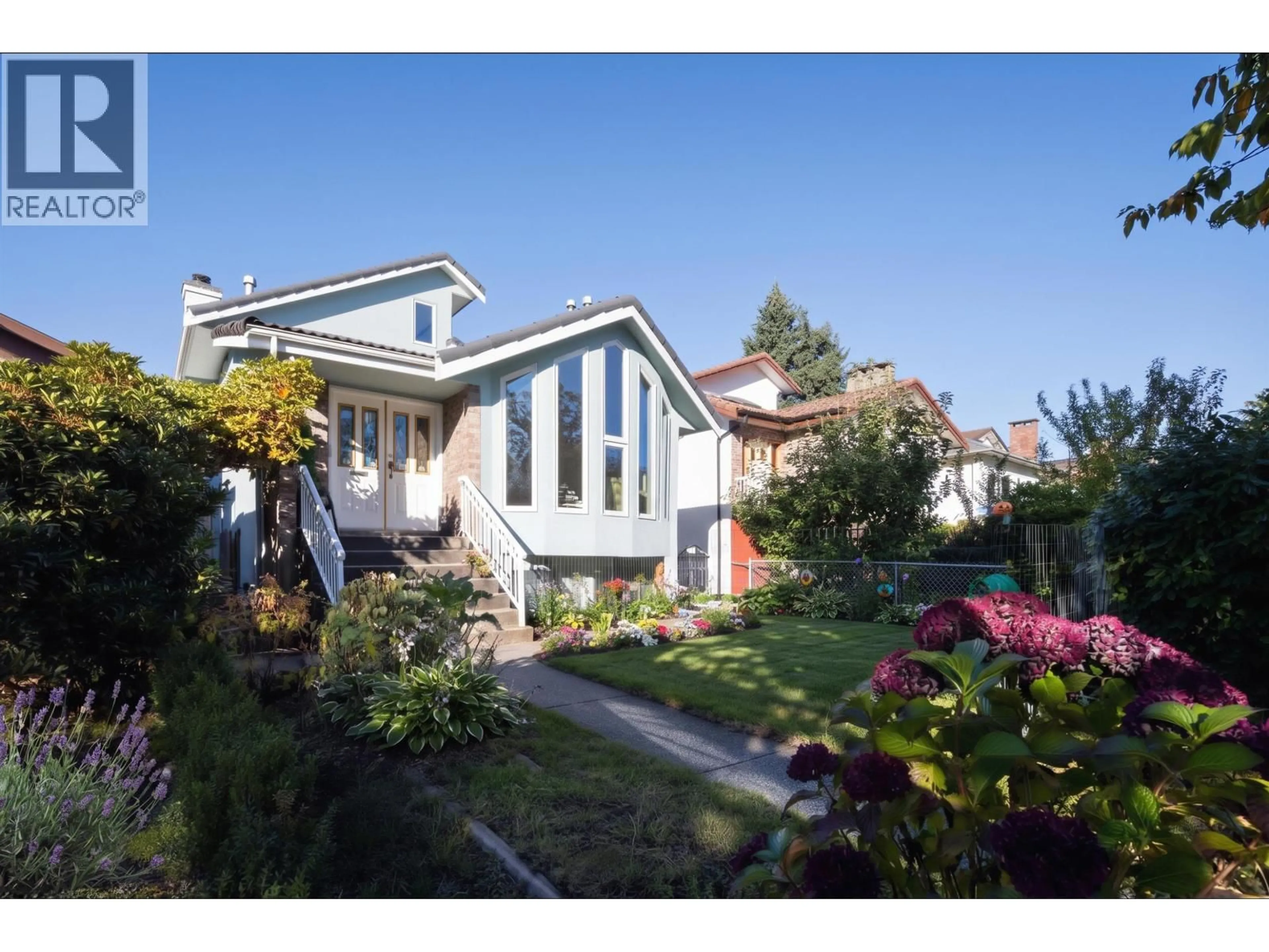 Home with vinyl exterior material, street for 2553 E 22ND AVENUE, Vancouver British Columbia V5M2X4