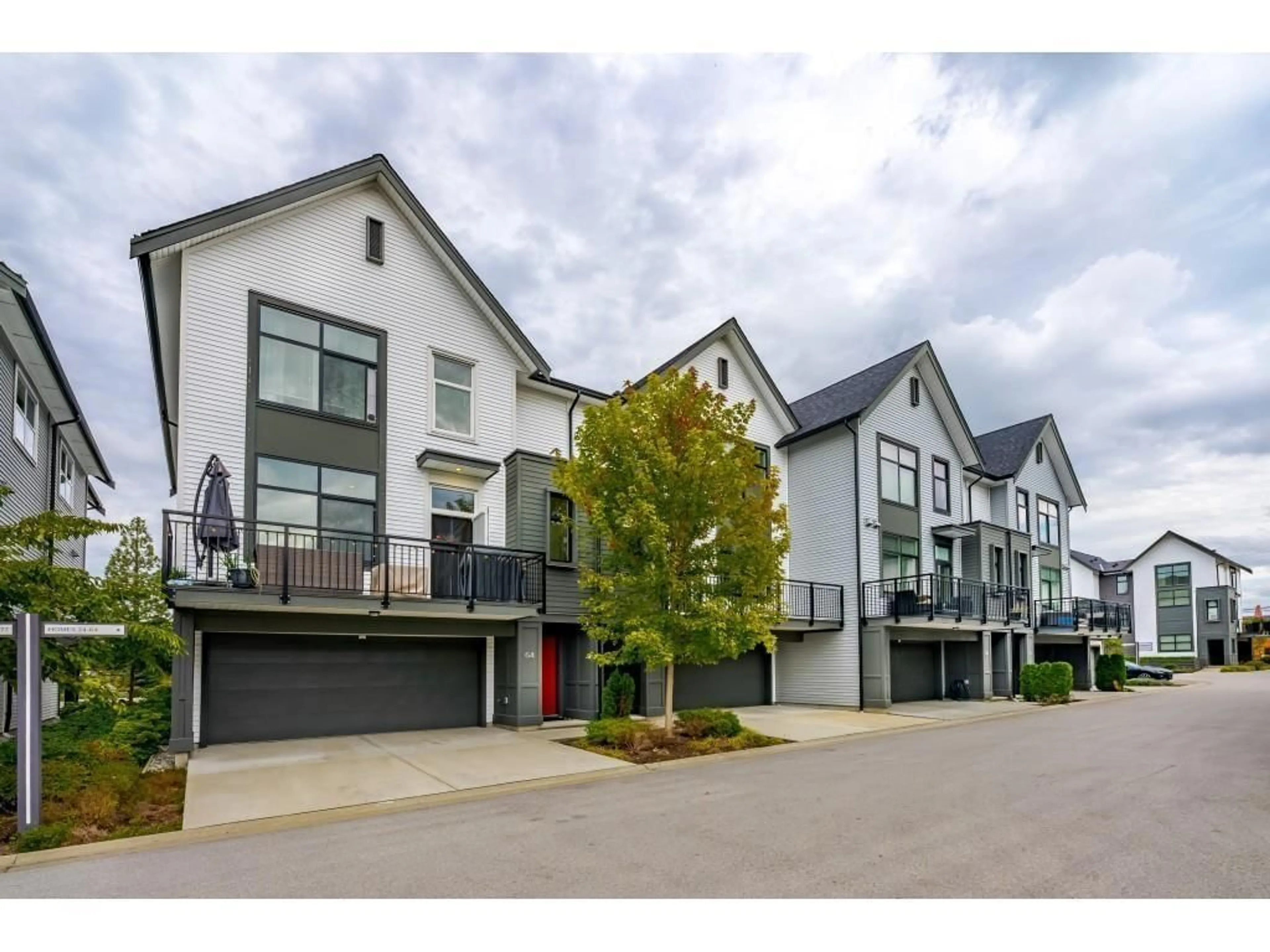 A pic from outside/outdoor area/front of a property/back of a property/a pic from drone, street for 64 - 17555 57A AVENUE, Surrey British Columbia V3S7V2