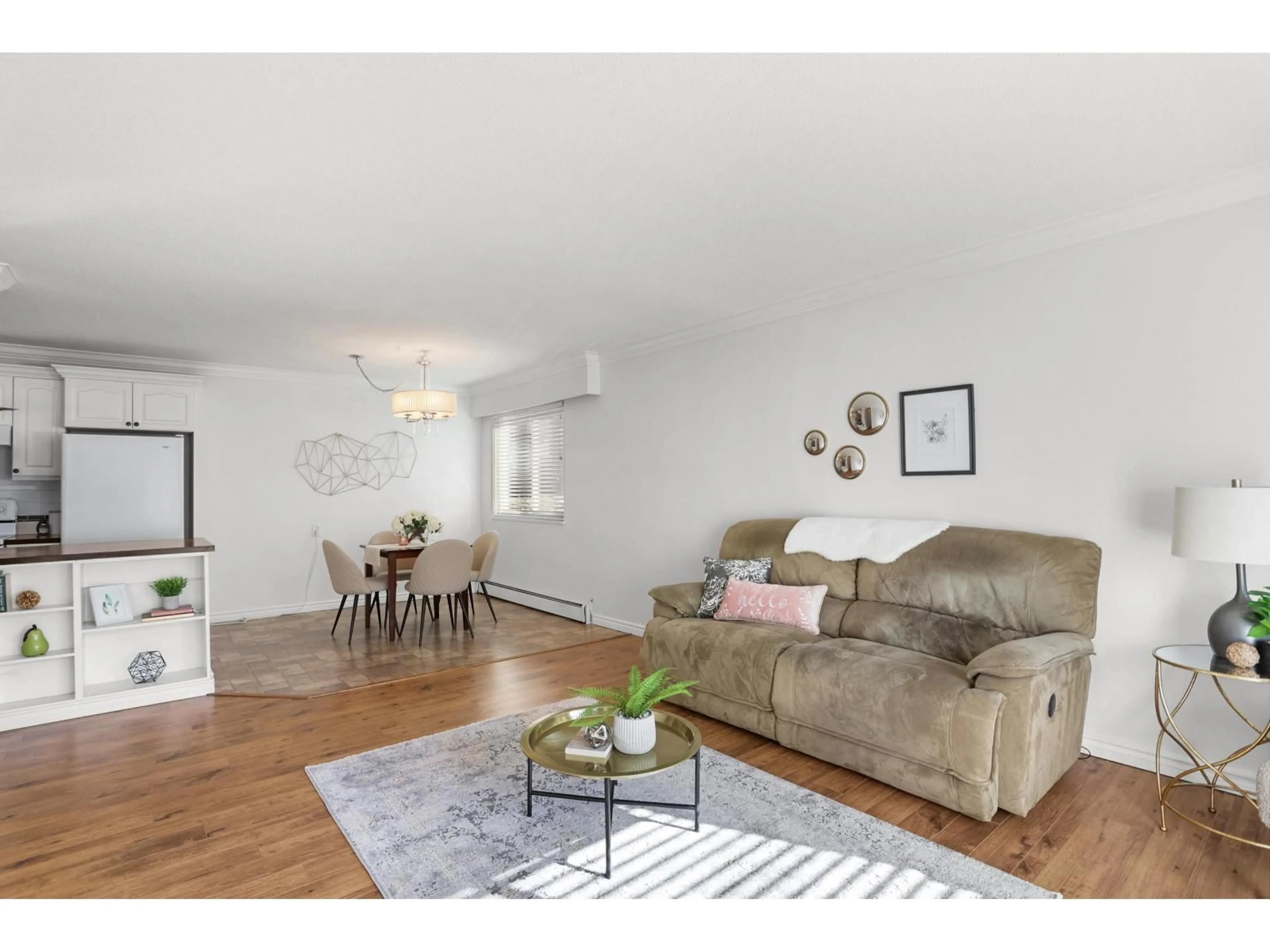Living room with furniture, wood/laminate floor for 218 - 17707 57A AVENUE, Surrey British Columbia V3S1J2