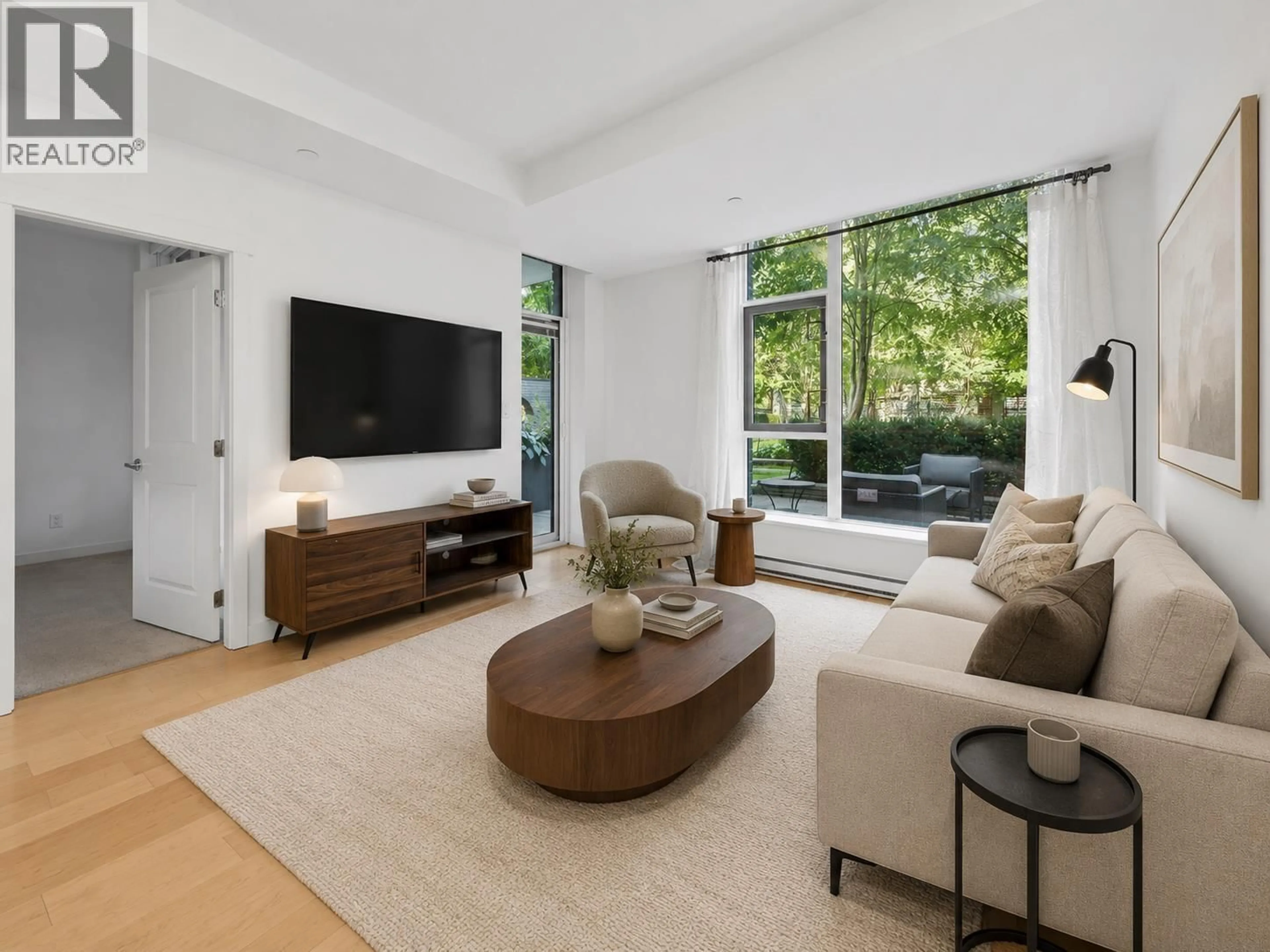 Living room with furniture, unknown for 105 - 5868 AGRONOMY ROAD, Vancouver British Columbia V6T0B5