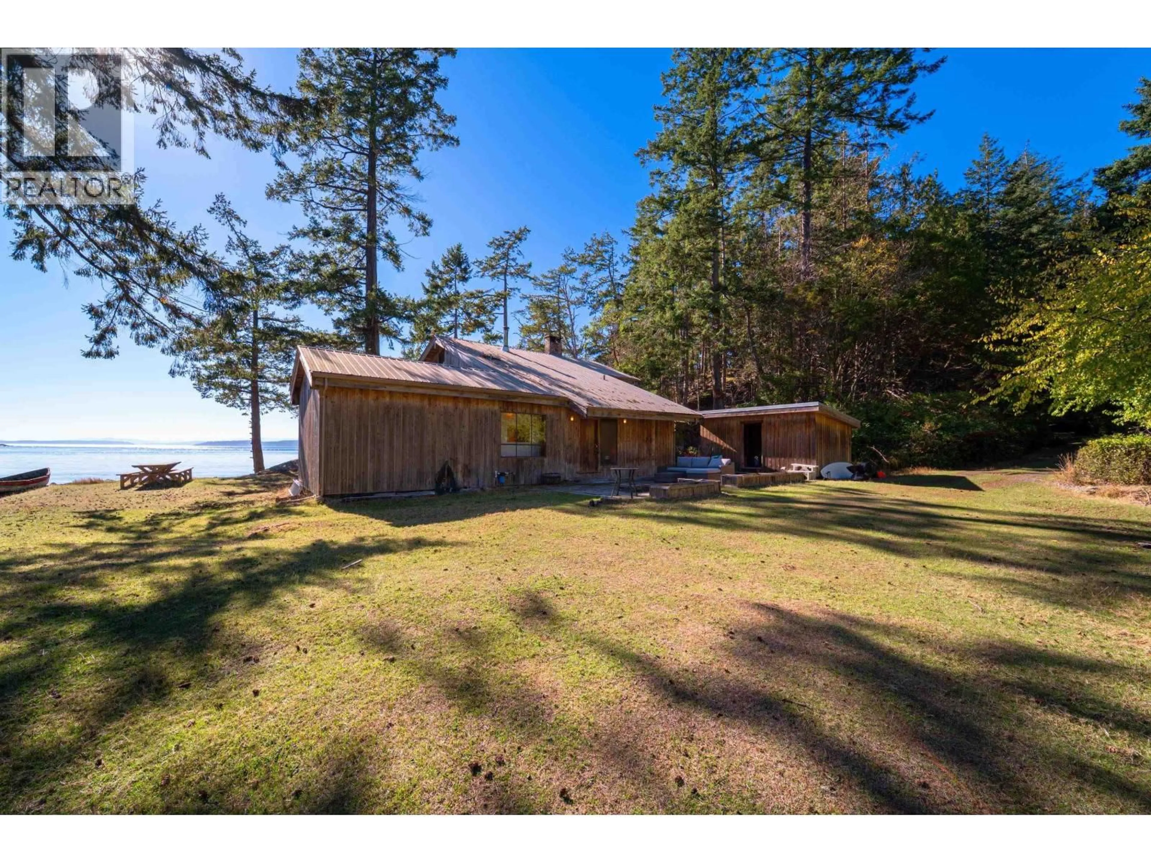 A pic from outside/outdoor area/front of a property/back of a property/a pic from drone, water/lake/river/ocean view for 671 DINNER BAY ROAD, Mayne Island British Columbia V0N2J2