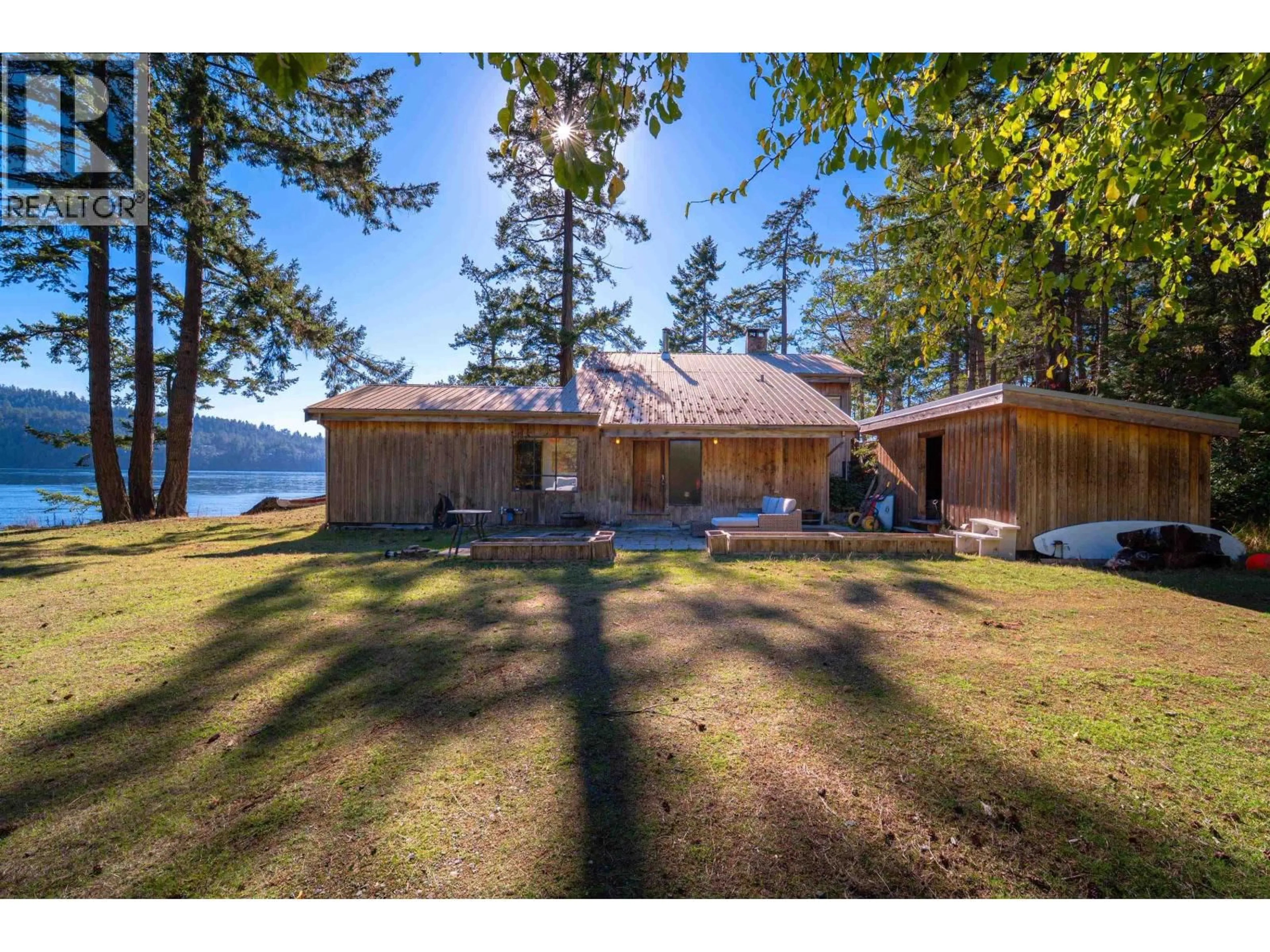 A pic from outside/outdoor area/front of a property/back of a property/a pic from drone, water/lake/river/ocean view for 671 DINNER BAY ROAD, Mayne Island British Columbia V0N2J2