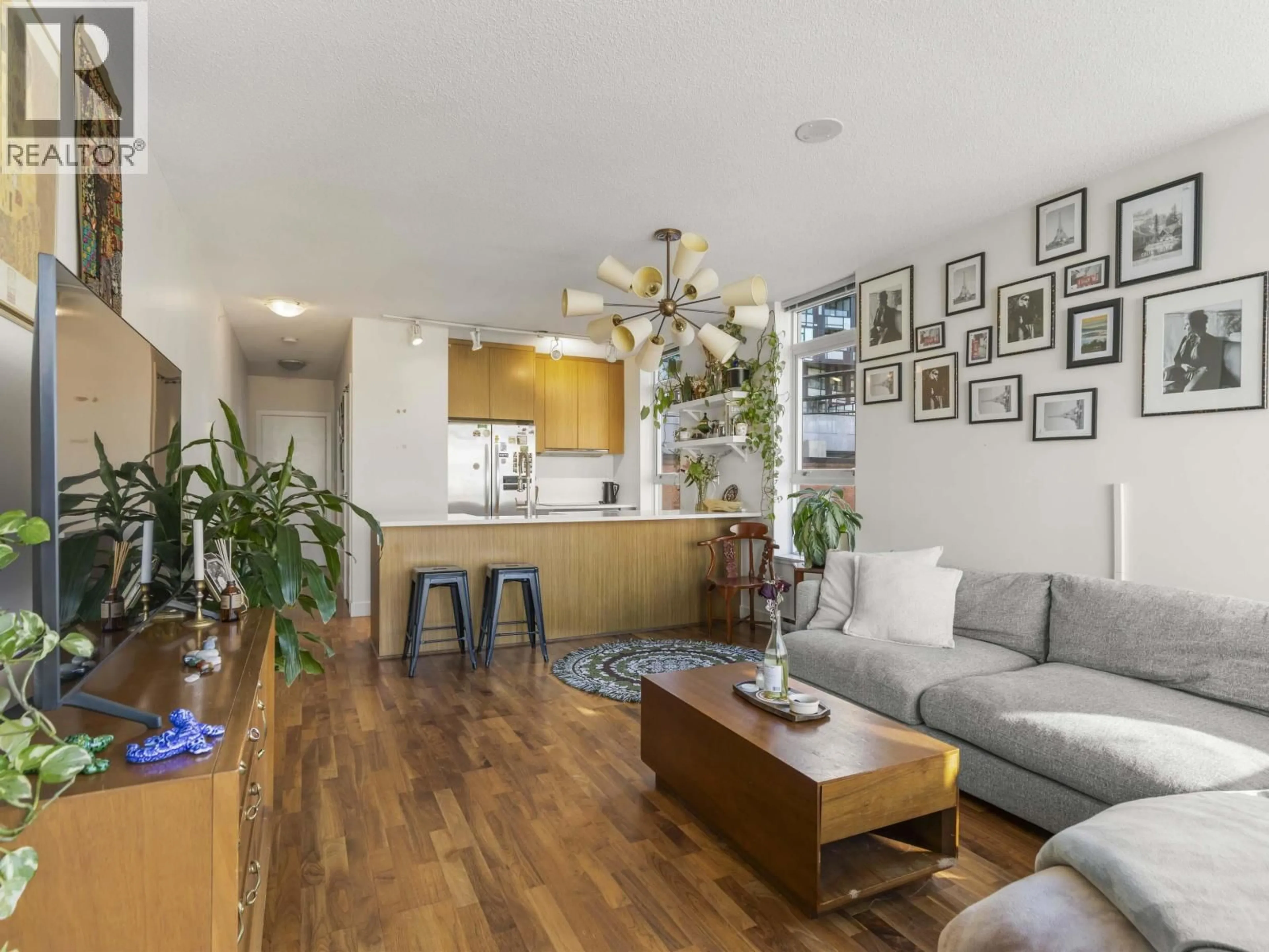 Living room with furniture, wood/laminate floor for 352 - 250 6TH AVENUE, Vancouver British Columbia V5T0B7